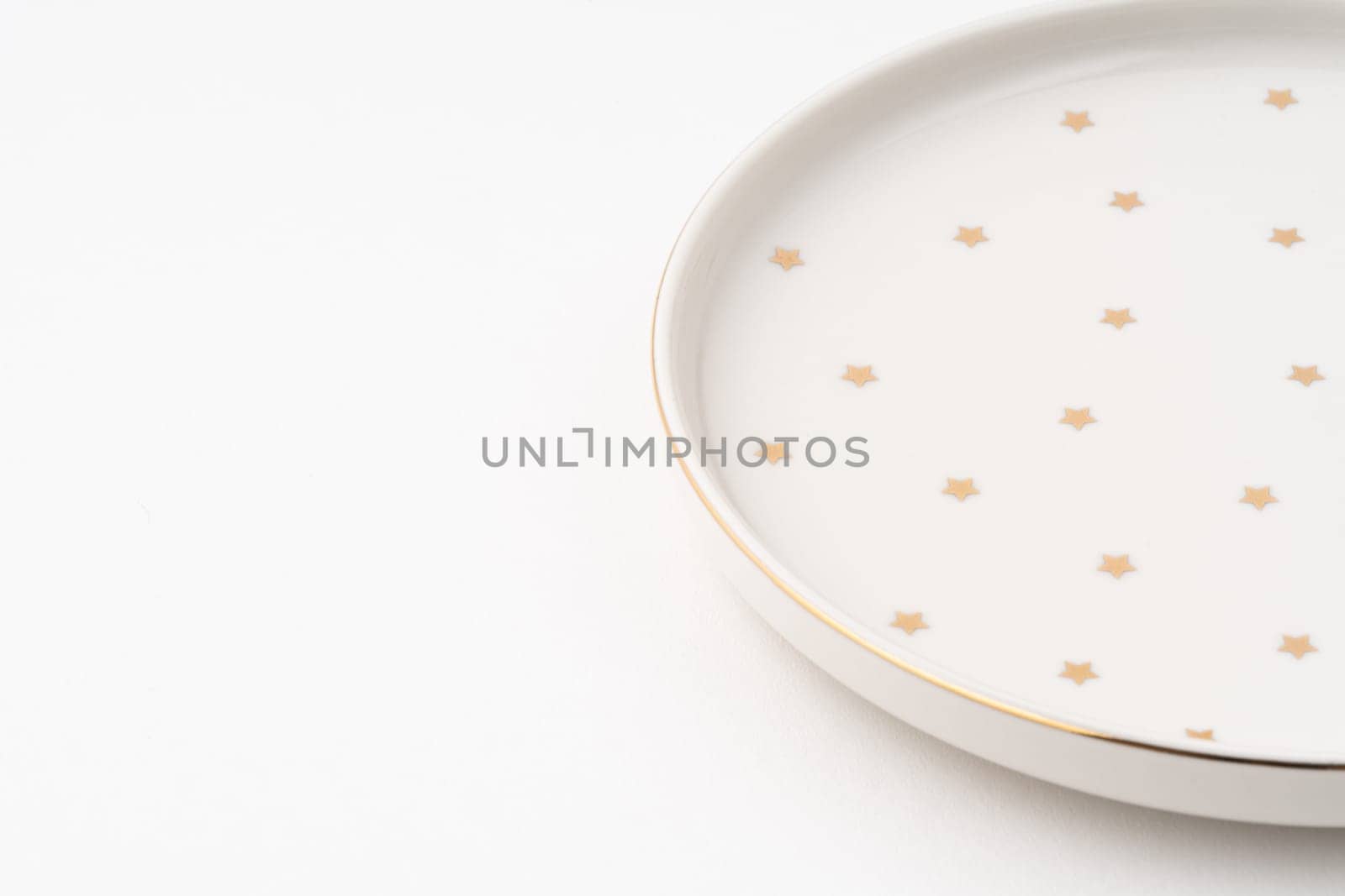 The one ceramic plate isolated on white background