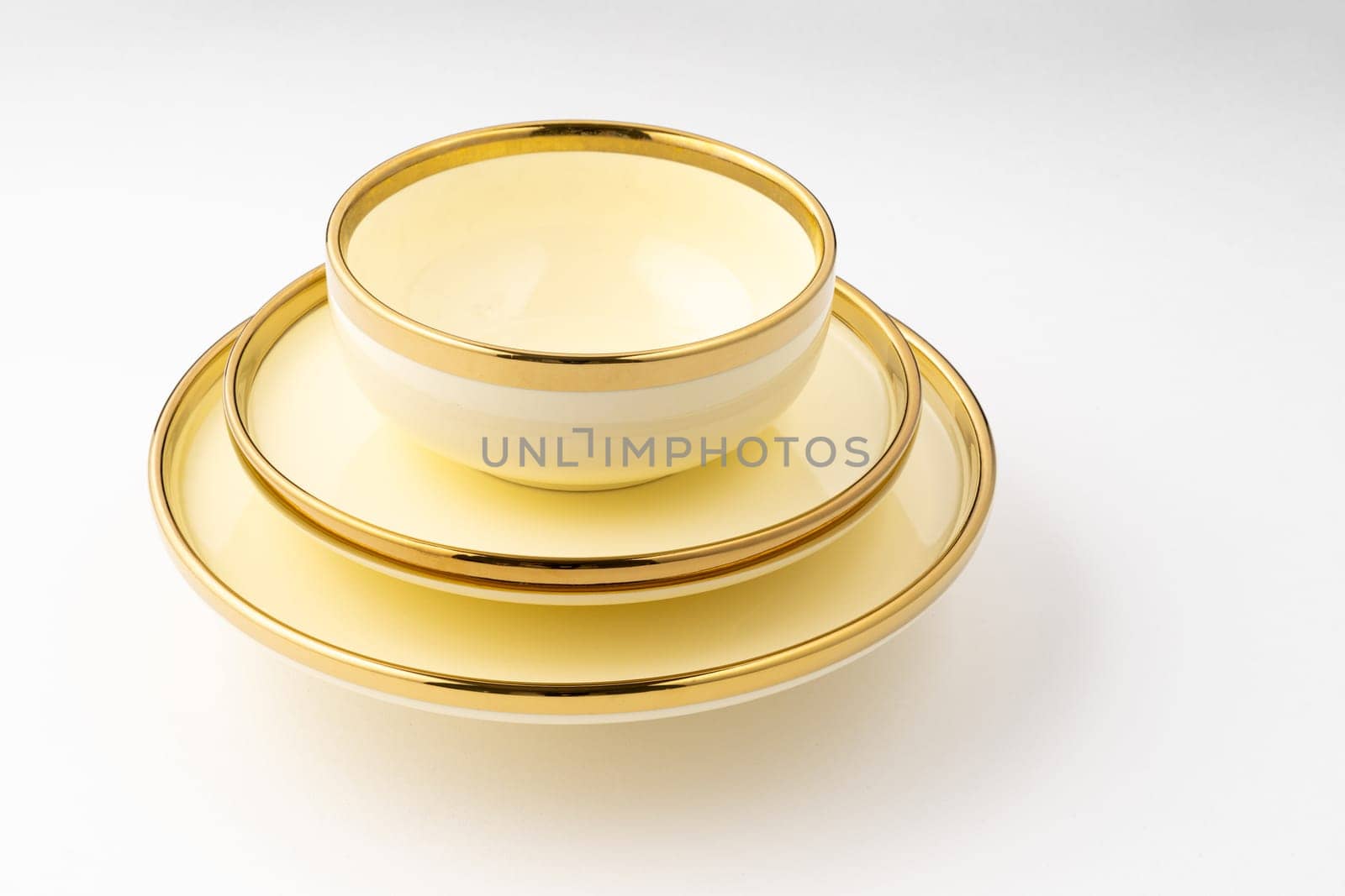 A golden luxury ceramic kitchen utensils on a white background