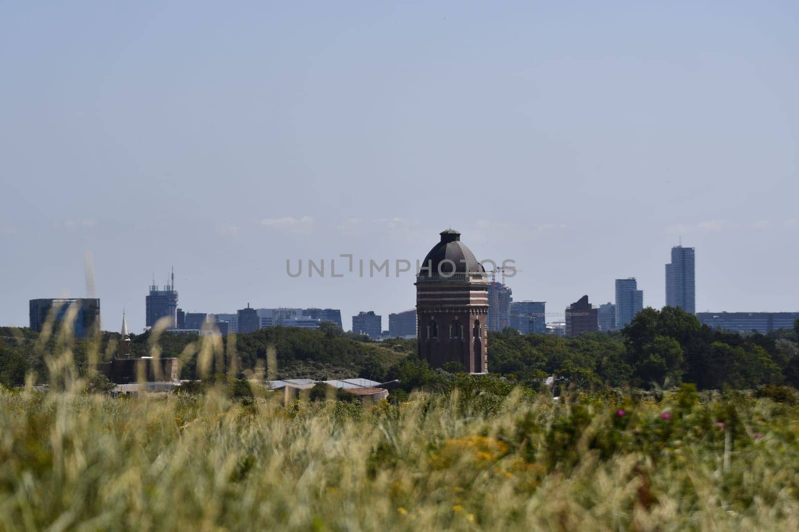 Old tower building in front of Scheveningen's skyline near Scheveningen, Netherlands