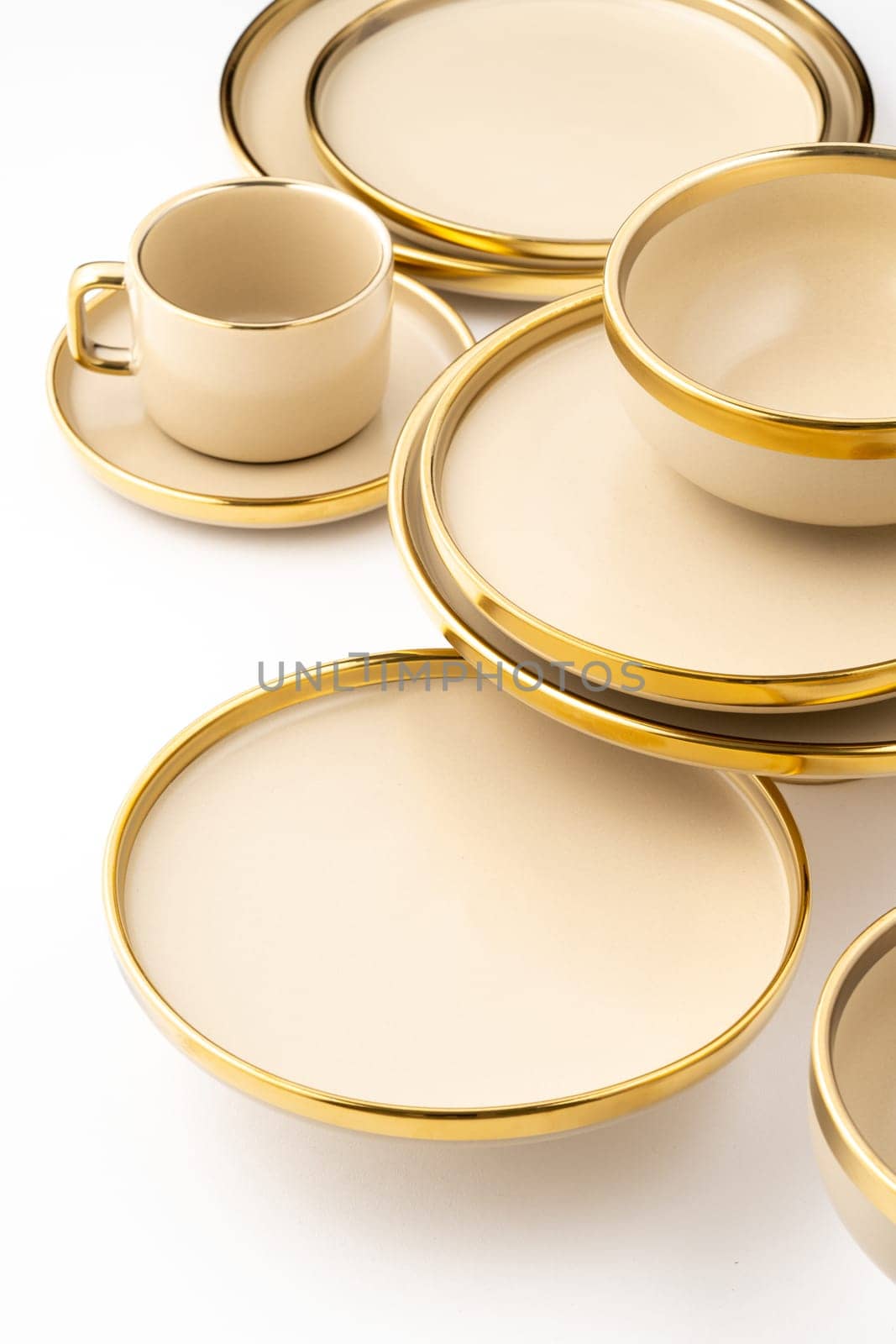 A Set of light brown ceramic plate and cup on a white background