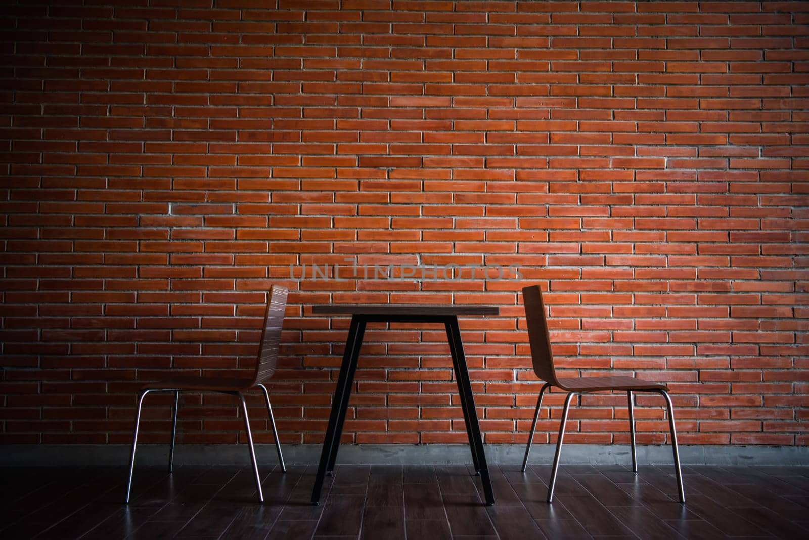 Cafe or restaurant in balcony view decorate with red brick wall and table chairs set for seating relax