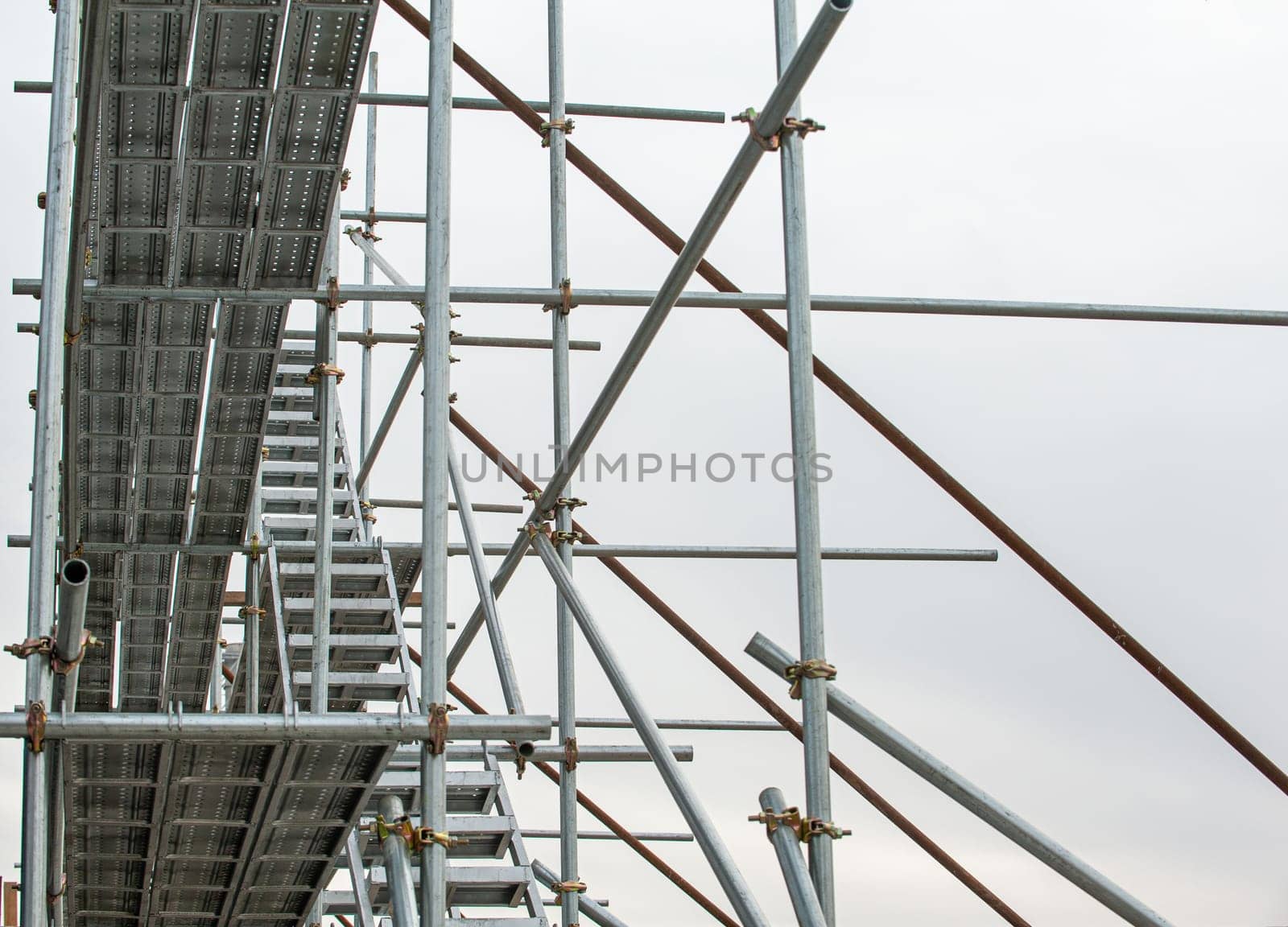 A scaffolding structure in construction site by A_Karim