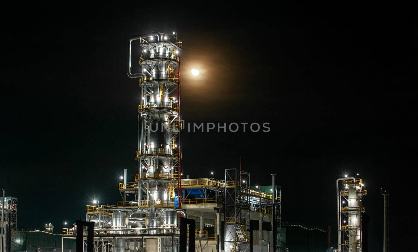 The oil refinery factory at night