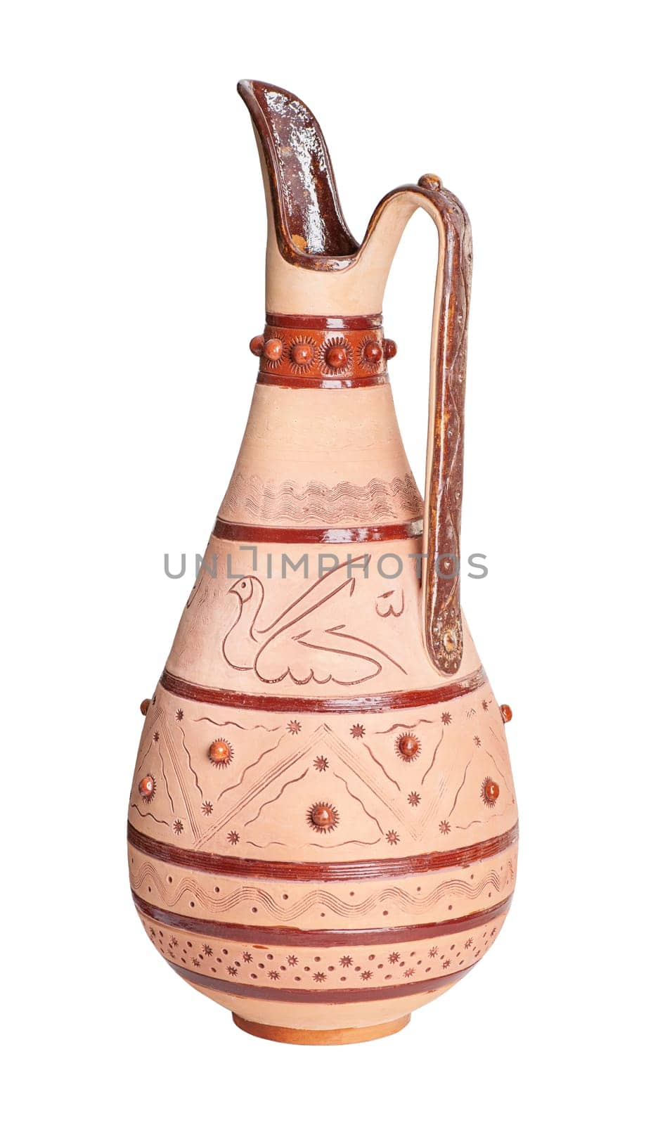 A vintage decorated ceramic jug isolated on a white background