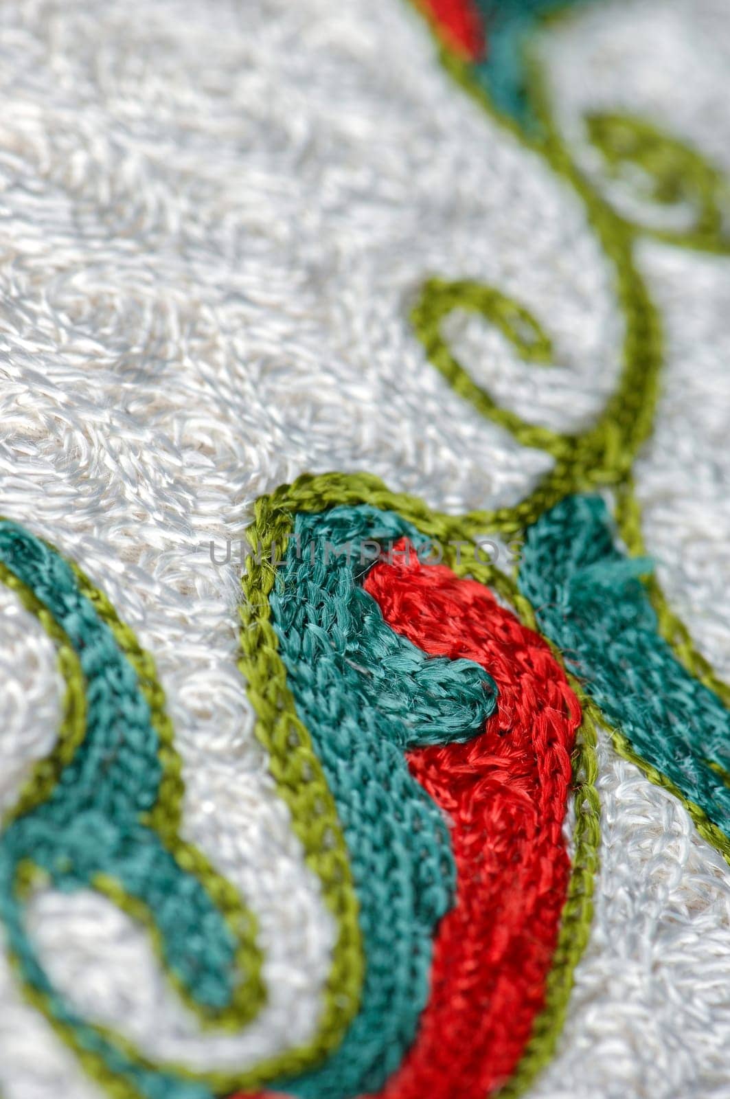 A closeup shot of national ornaments and patterns of Central Asia on a piece of fabric by A_Karim