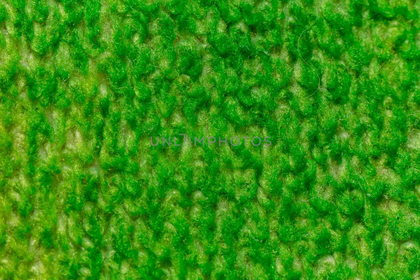 Dark green background from a textile material with wicker pattern, closeup. by clusterx