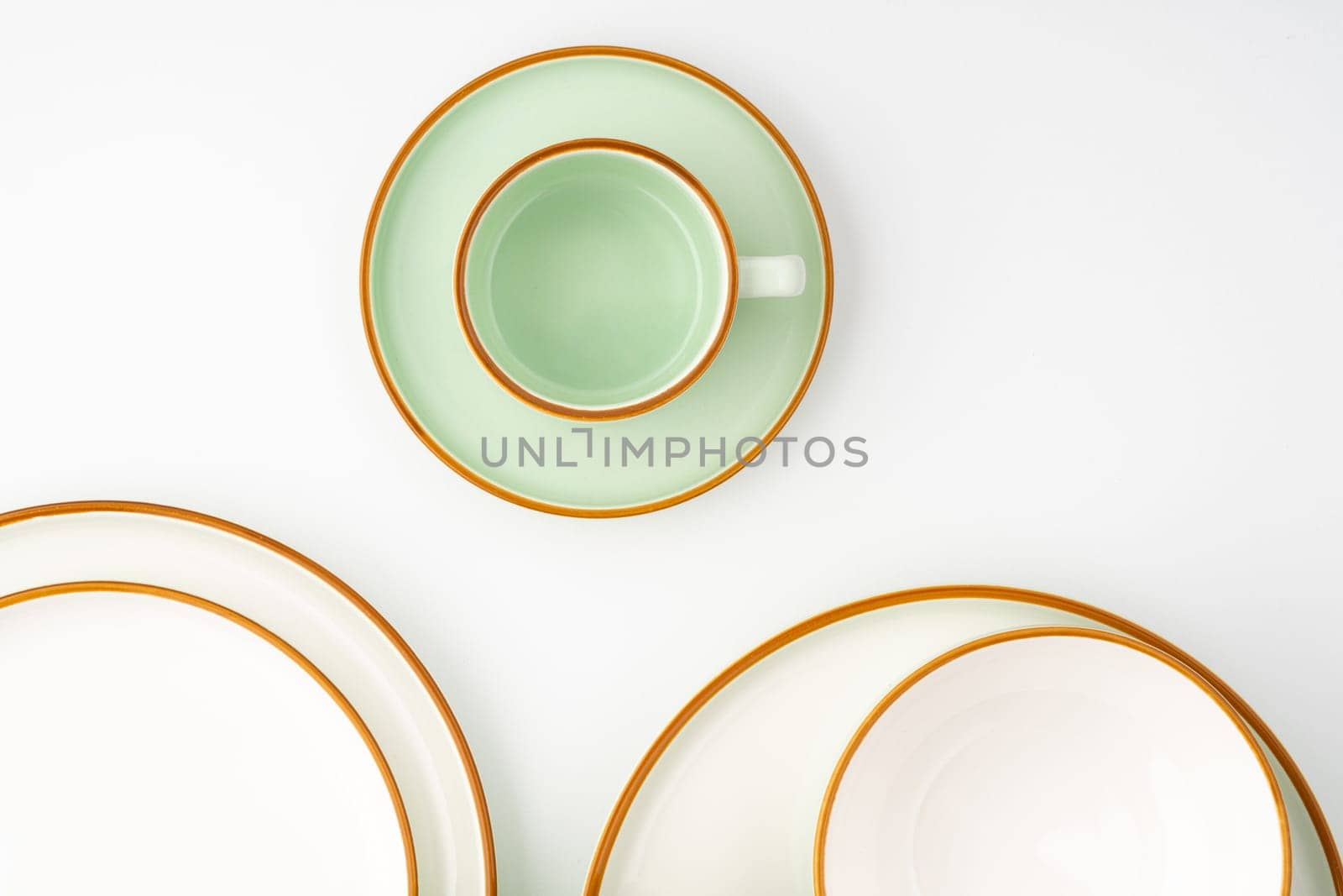 A set of ceramic tableware isolated on white background