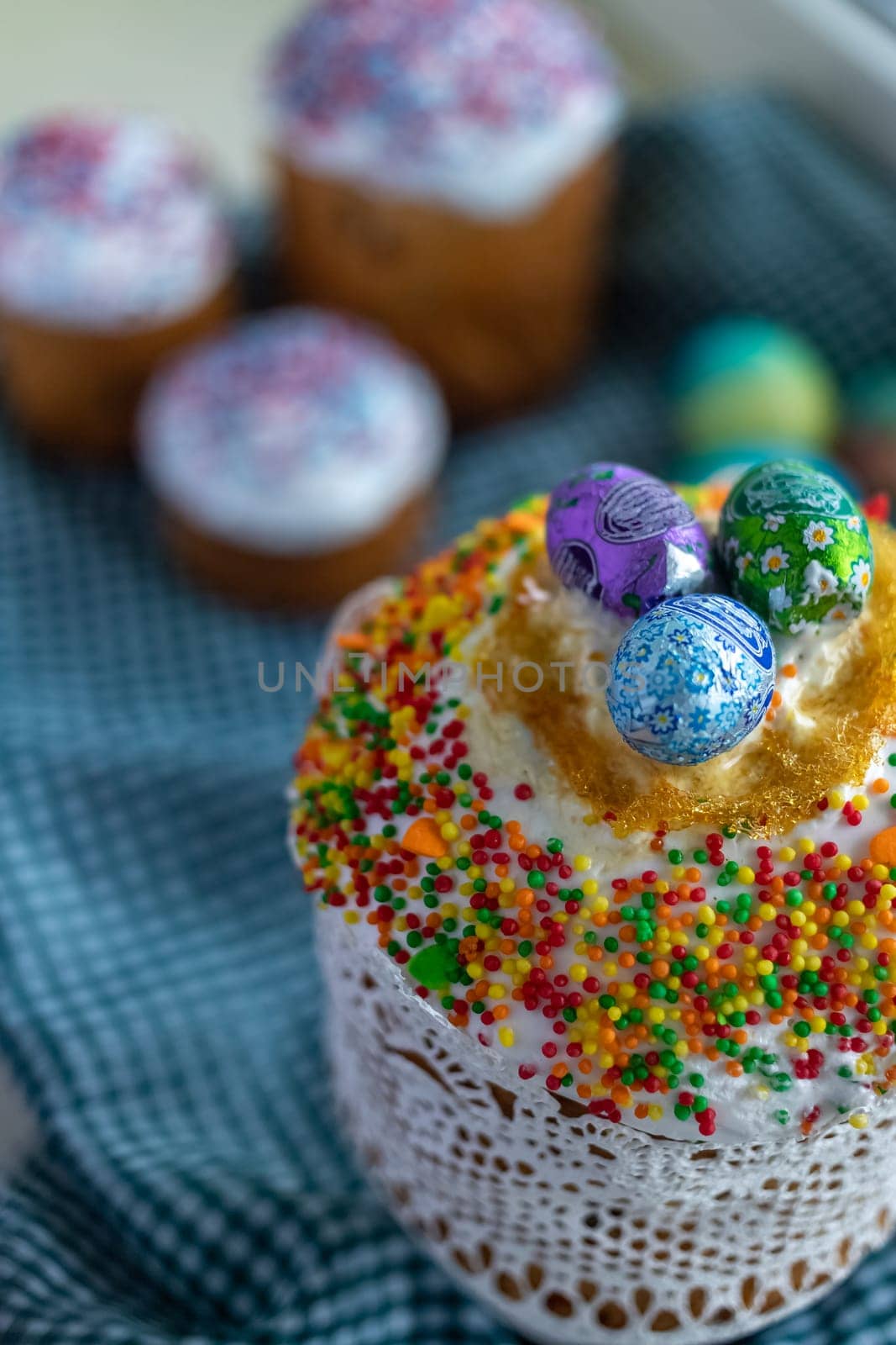 Traditional Easter cake with glace icing and painted easter eggs.Rustic style. Easter arrangement.Easter cake with glace icing and decoration