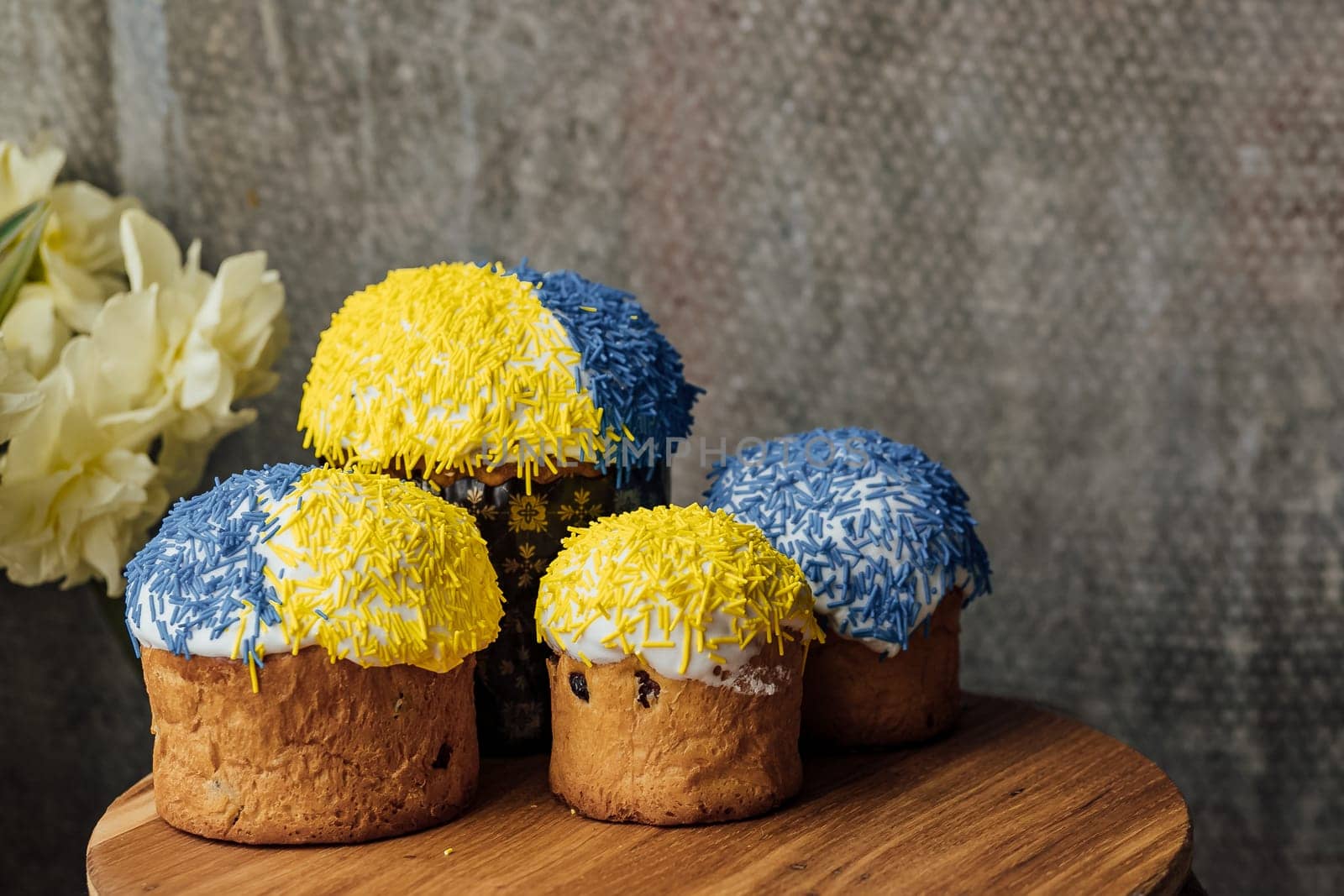 Delicious Easter cake and ingredients on wooden table.