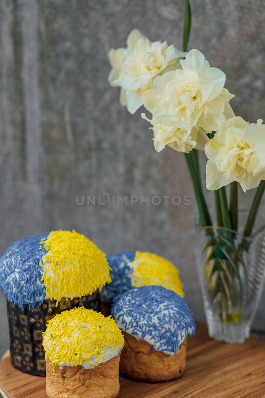 Delicious Easter cake and ingredients on wooden table.