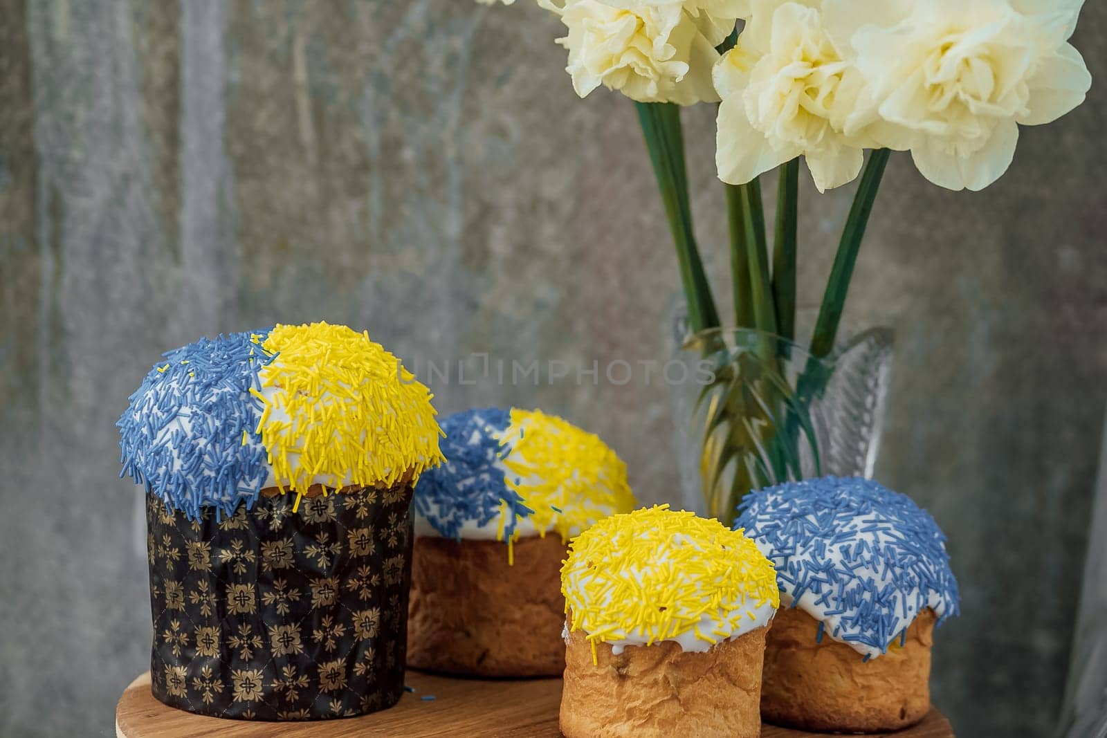 Delicious Easter cake and ingredients on wooden table.