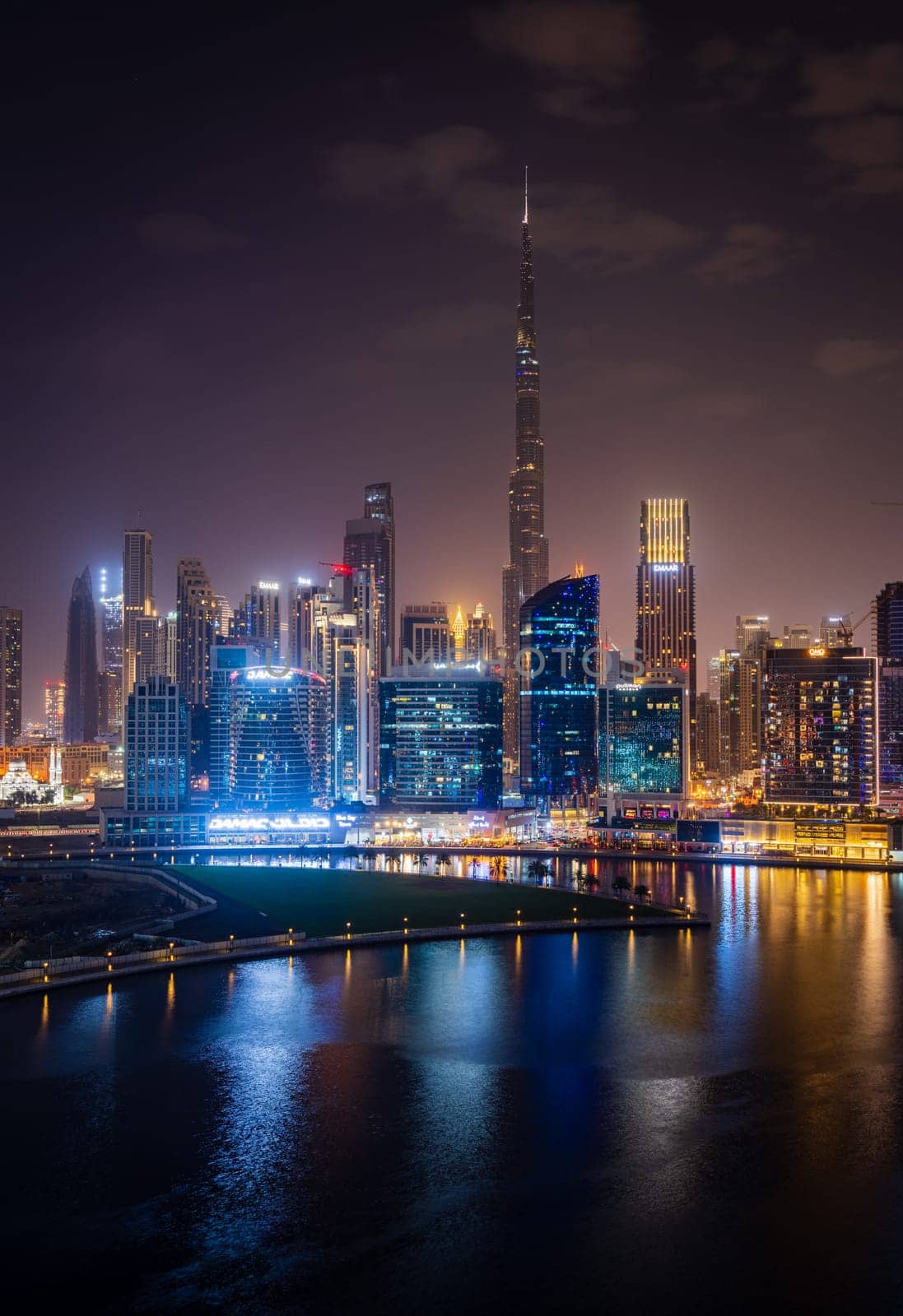 Dubai, UAE - April 1, 2023: Night view of skyline of downtown district from apartment in Business Bay