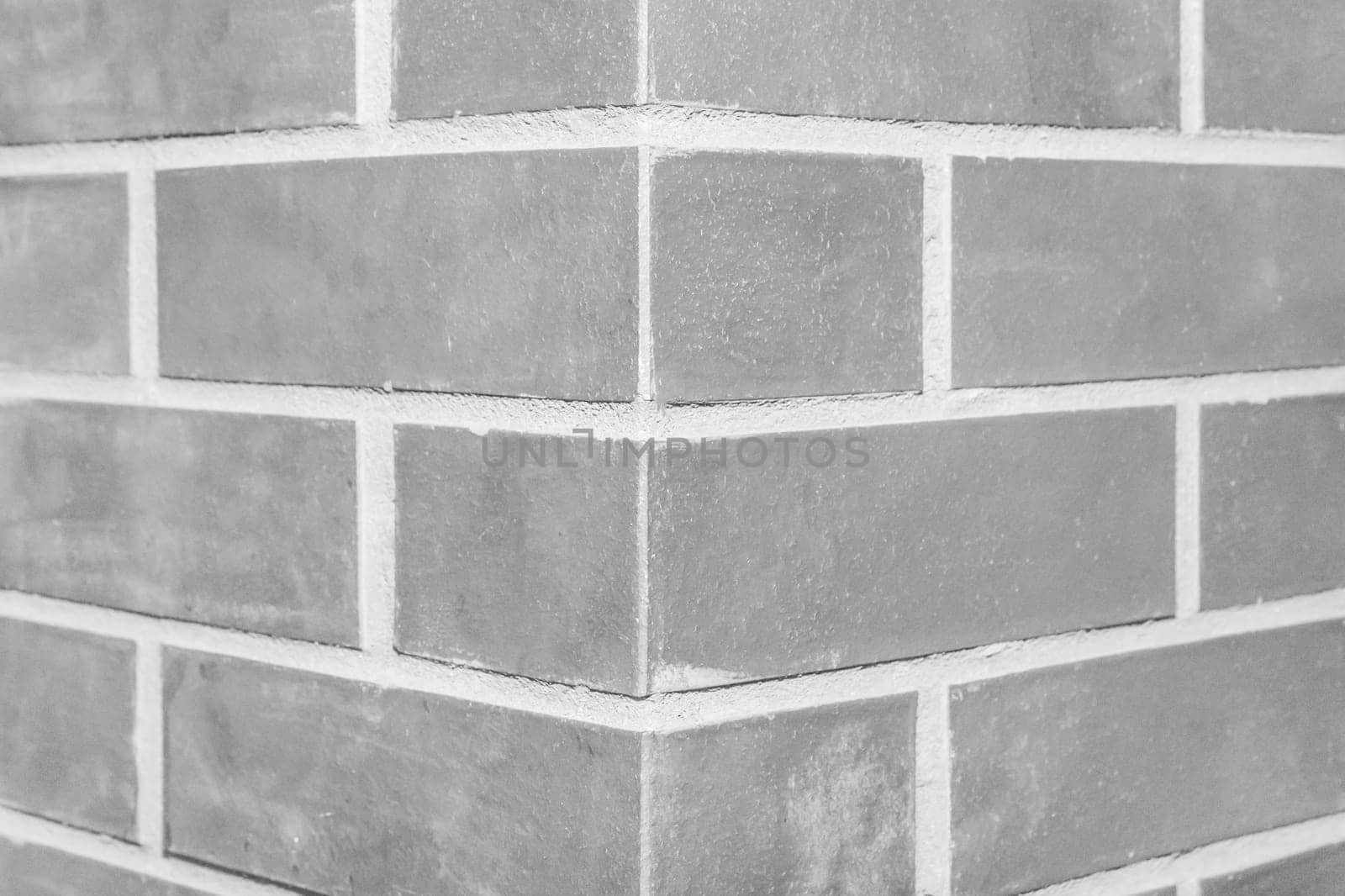 Corner brick column fragment close-up architecture of the joint grey wall of the interior texture background by AYDO8