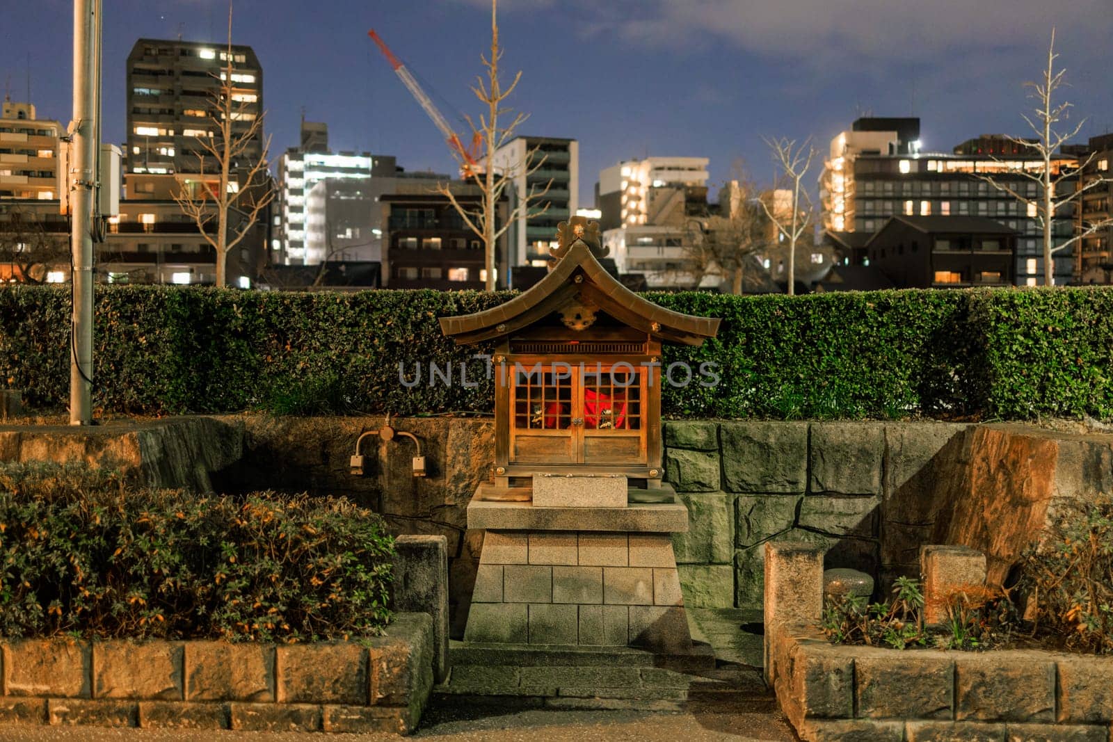 Small neighborhood shrine on quiet Kyoto street at night by Osaze