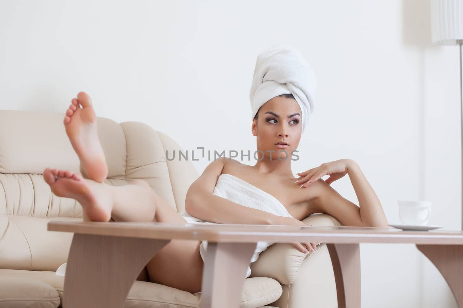Portrait of sexy young woman posing after shower, close-up