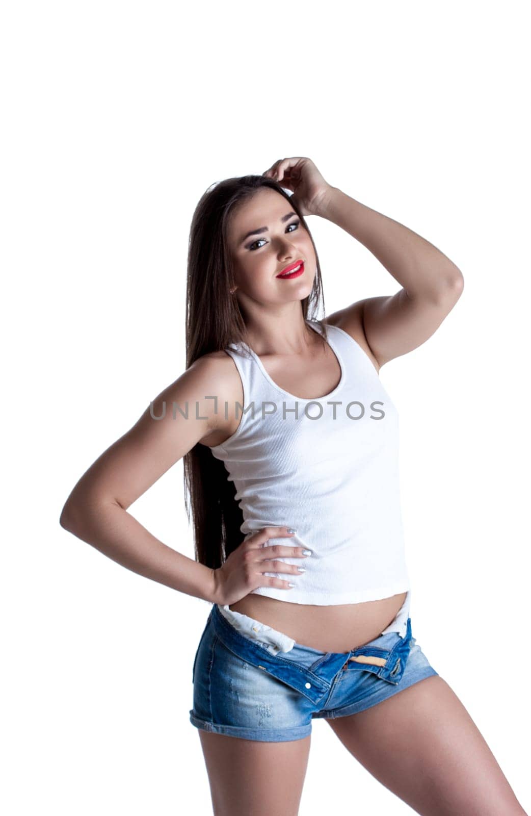 Smiling young brunette posing in casual clothes, close-up