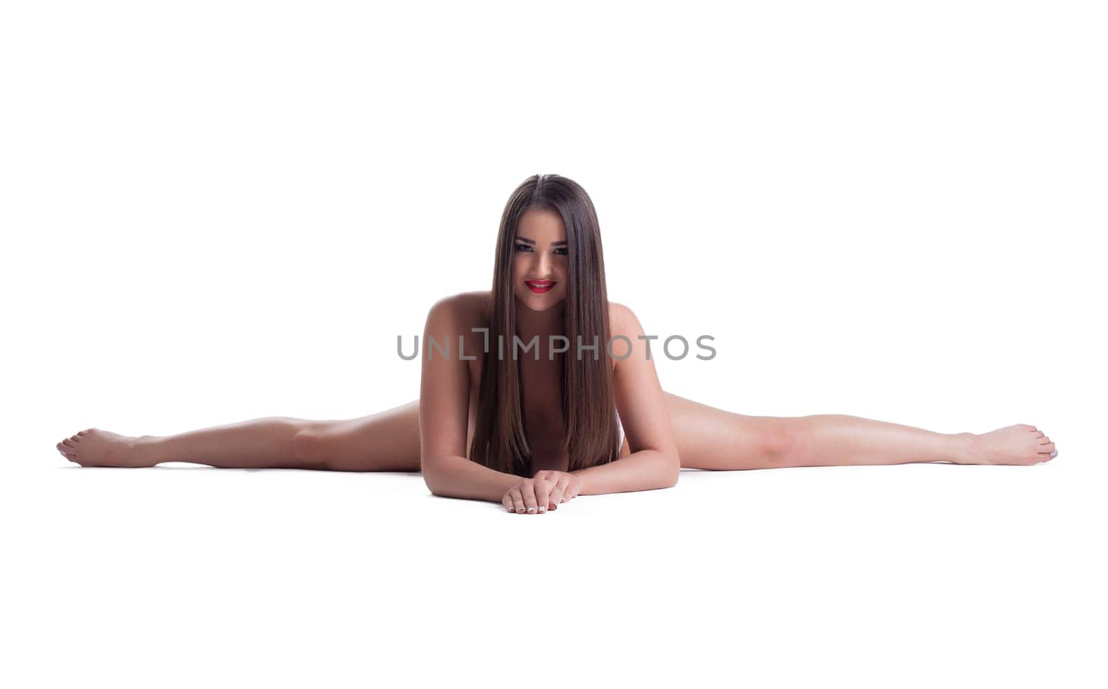 Beautiful smiling brunette posing naked in studio, isolated on white