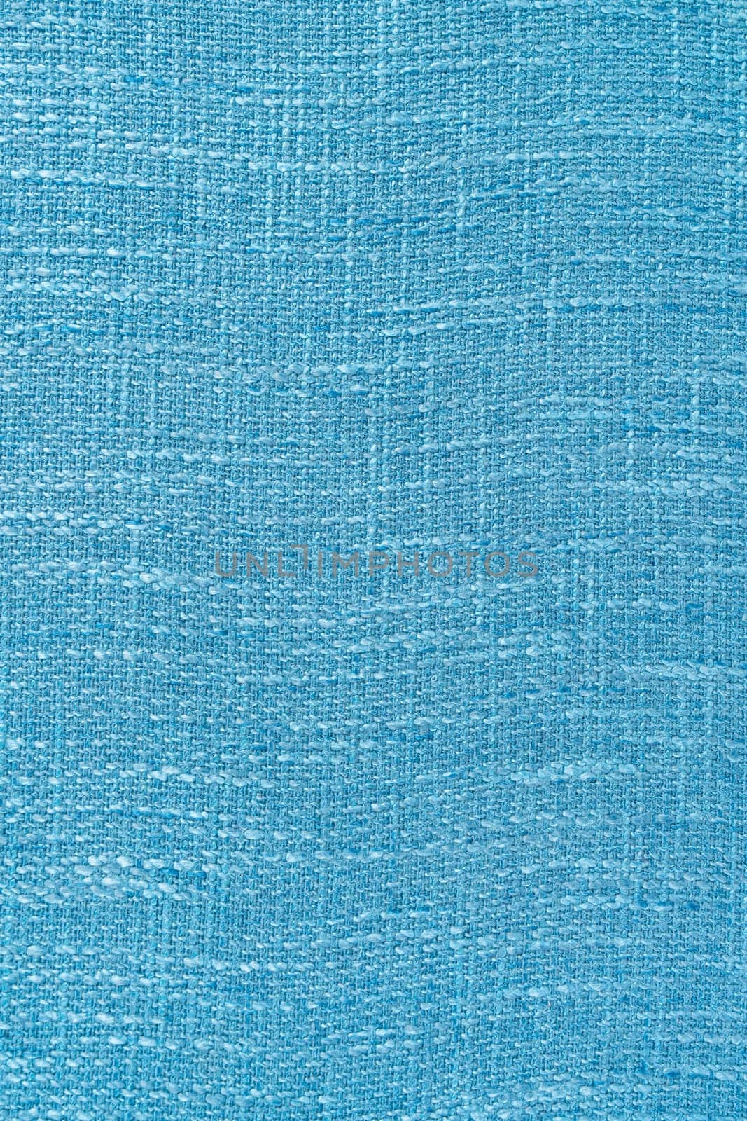 Close up shot colored light blue fabric texture as background.