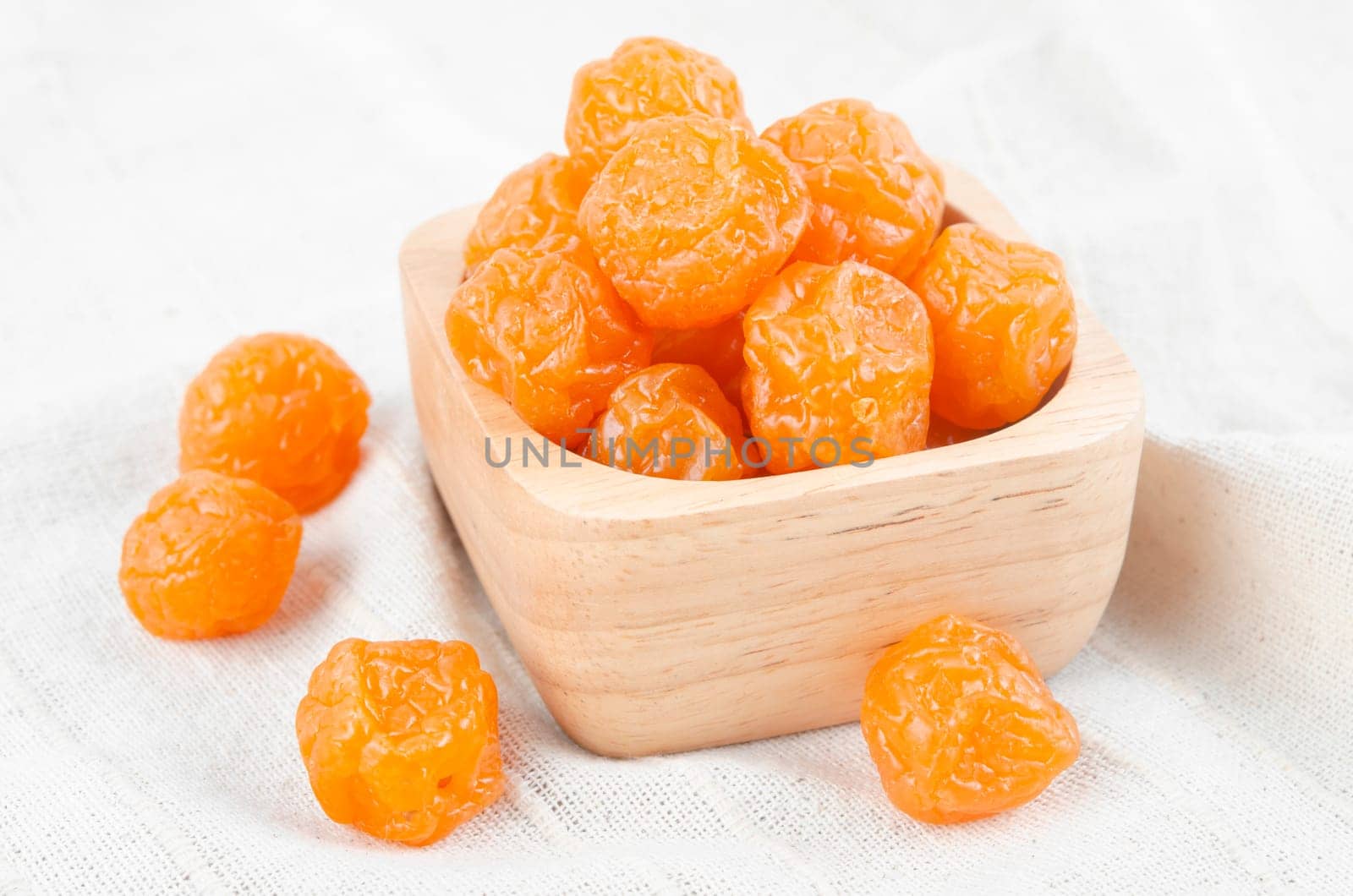 Reserved fruits or dried honey Chinese plum on wooden background