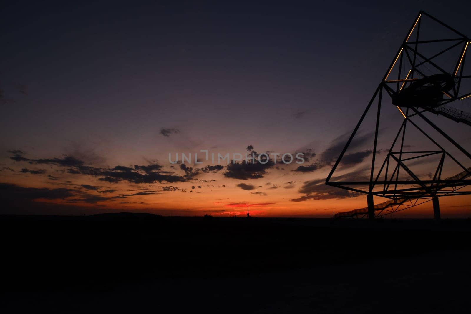 Viewing platform Tetraeder in Bottrop, Germany at sunset