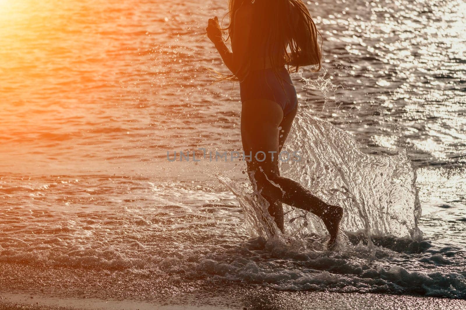 Running woman. Female runner jogging during the sunrise on beach. Woman Runner feet running on the beach at sunrise. woman fitness sunrise jog workout wellness concept.