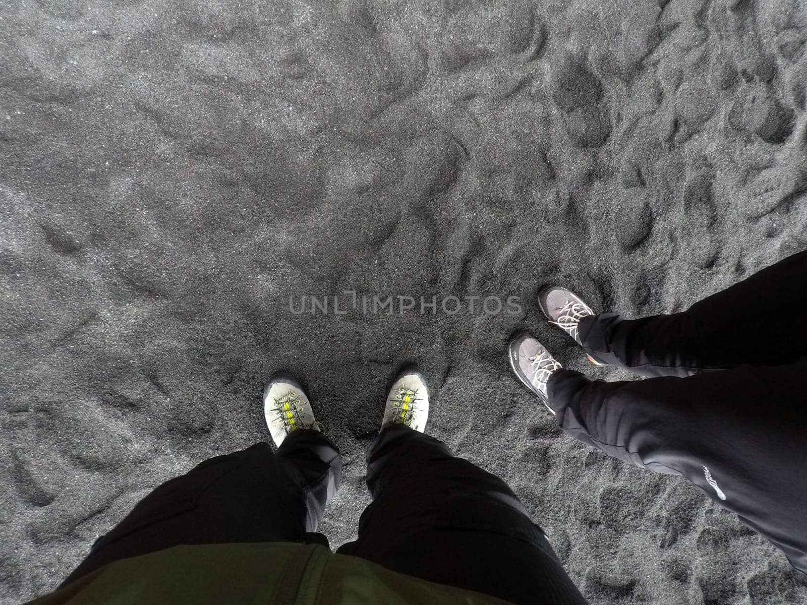 Hiking boots at Black Sand Beach Reynisfjara, Iceland
