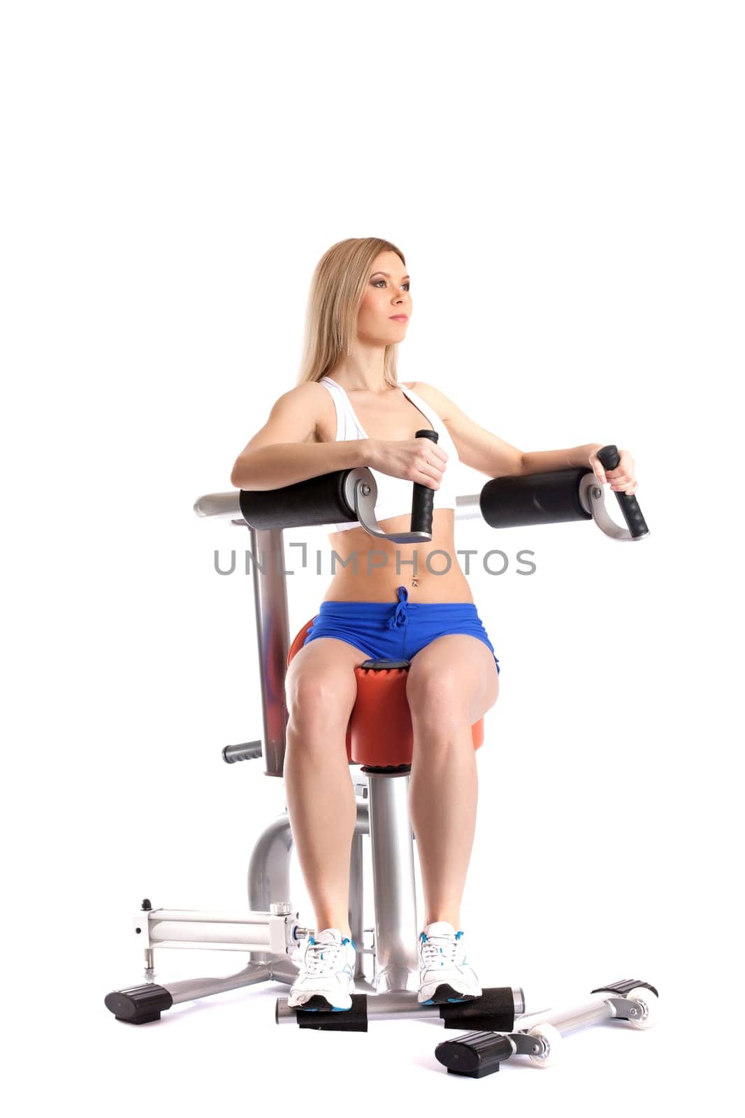 Sporty woman exercising on modern hydraulic simulator