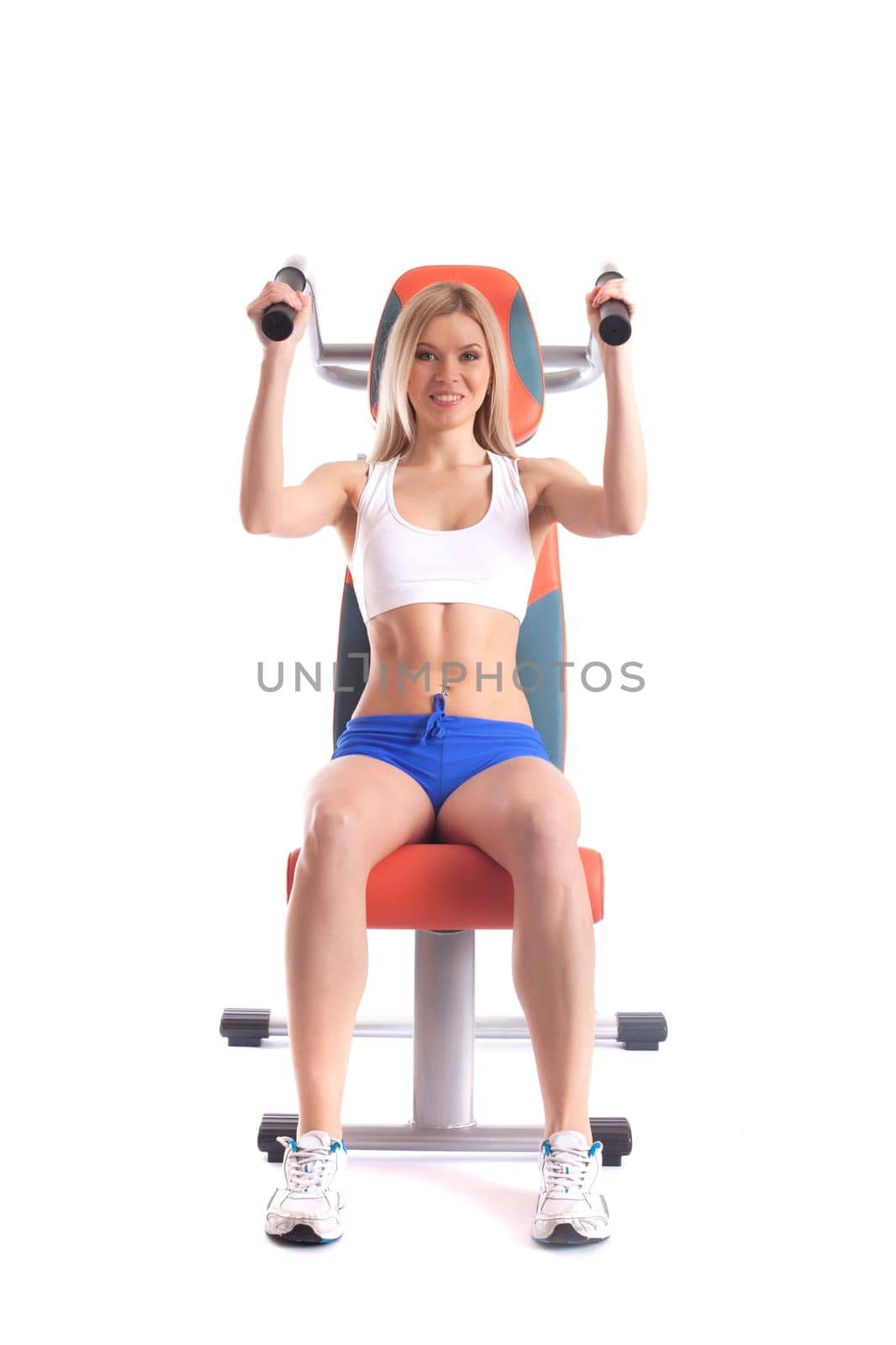 Smiling athlete exercising on isodynamic simulator, isolated over white background