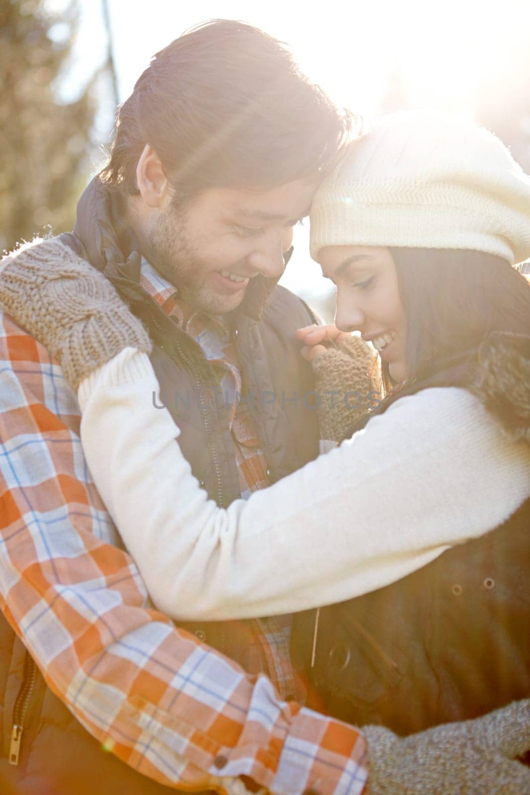 Everlasting love...A loving young couple being affectionate while standing together in the outdoors