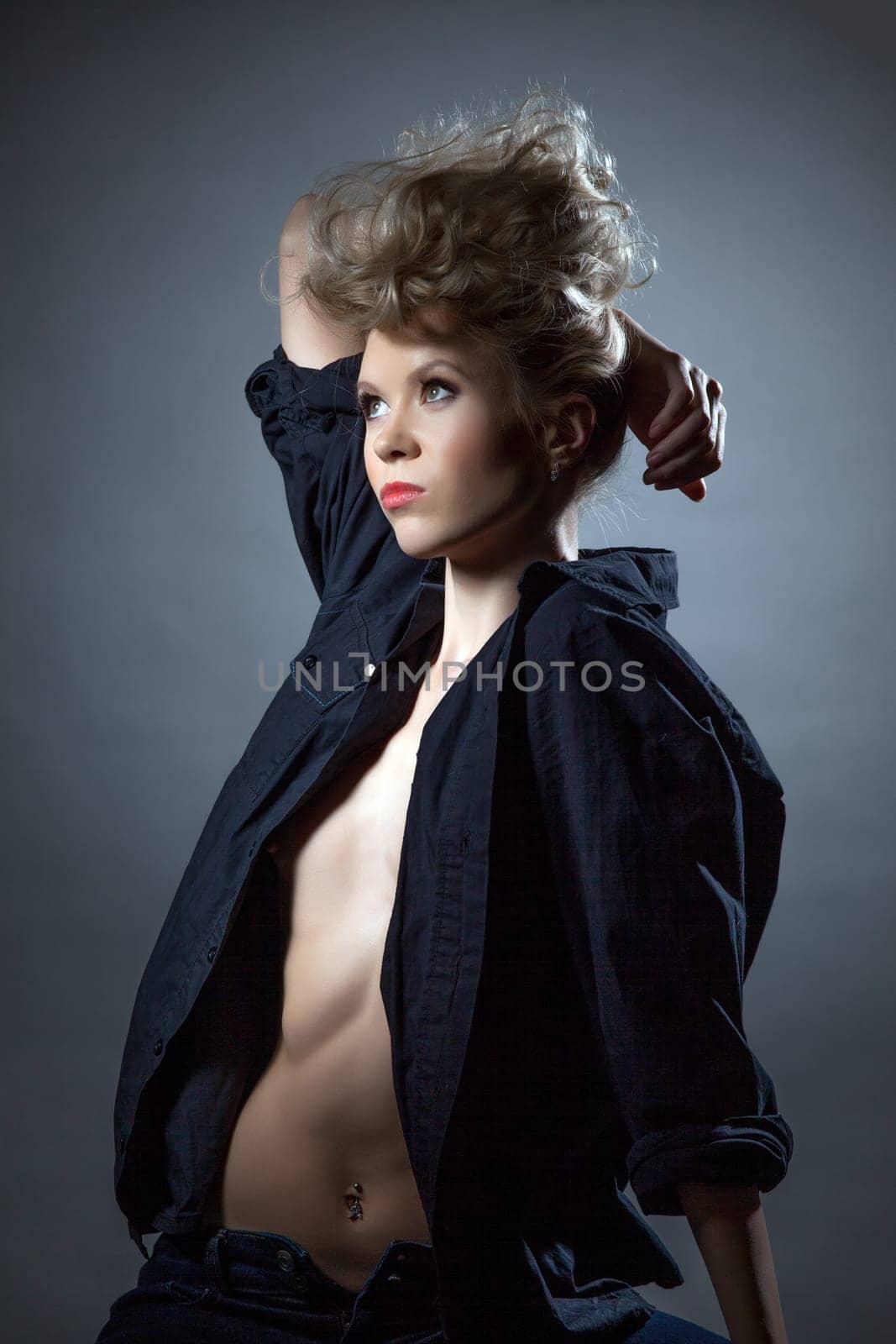 Image of confident girl posing topless in shirt, close-up