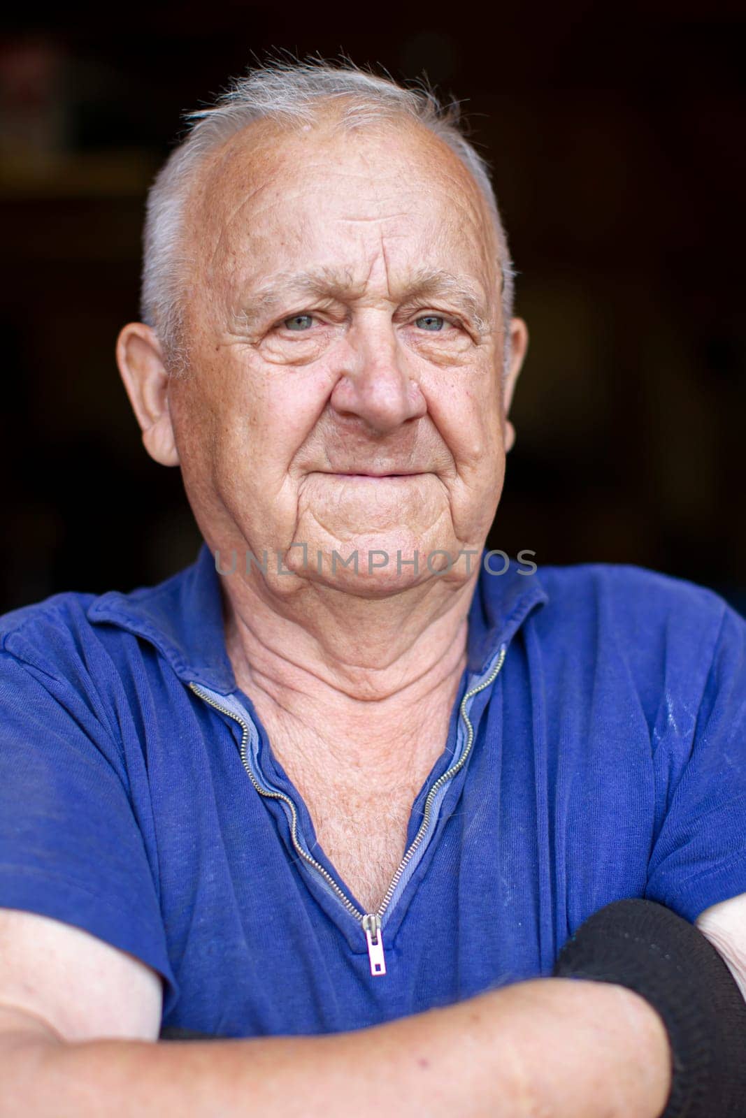 Portrait of an elderly gray-haired man. Man in eighty years.