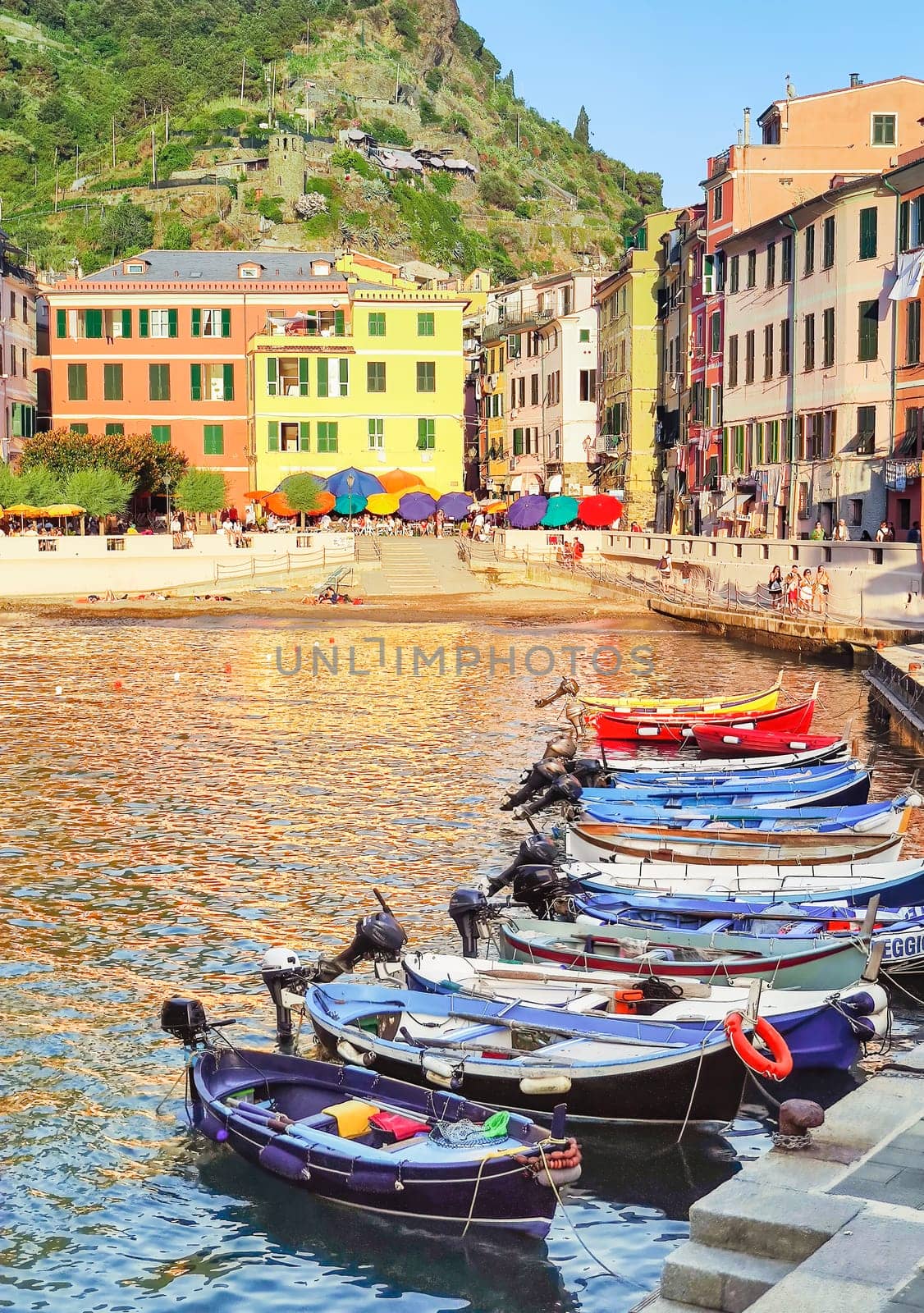 Travelogue of the Cinque Terre may be seen at the Ligurian tourist port of Vernazza with moored fishing boats.