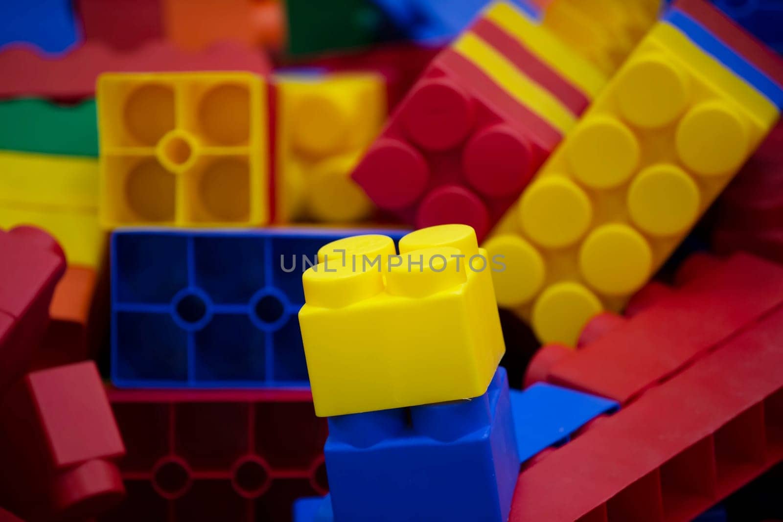 Multi-colored blocks of plastic constructor. by Sviatlana