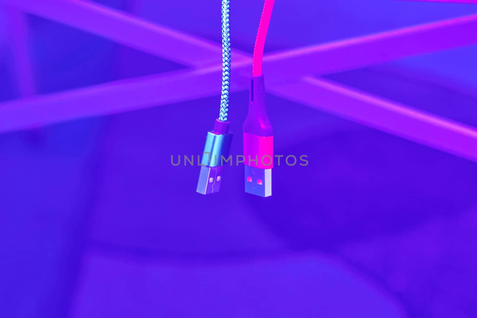 bring together or into contact so that a real or notional link is established. Connect and chat. Connect and chat. Blue and red usb cables on pale purple background
