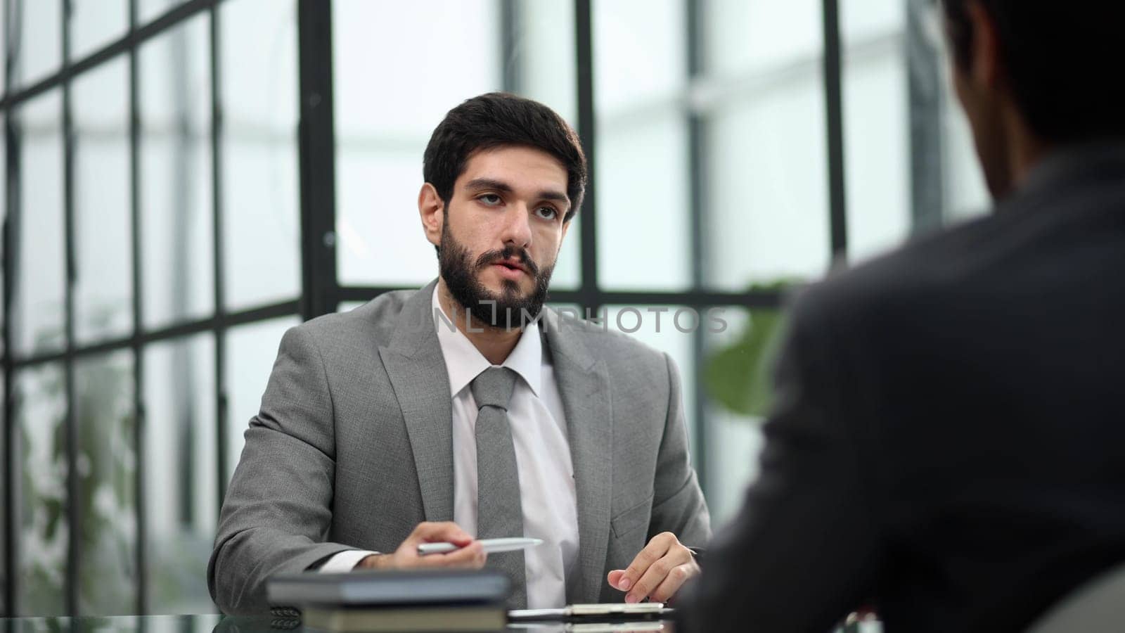 Two business people in the office at the table