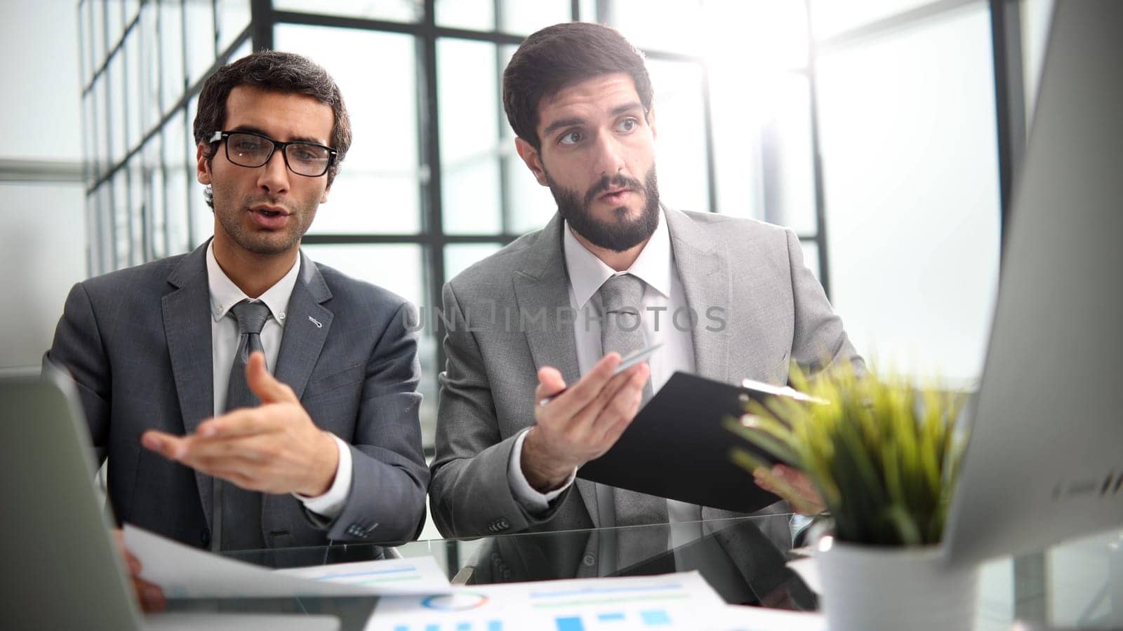 Manager and the client sitting in the office lobby.