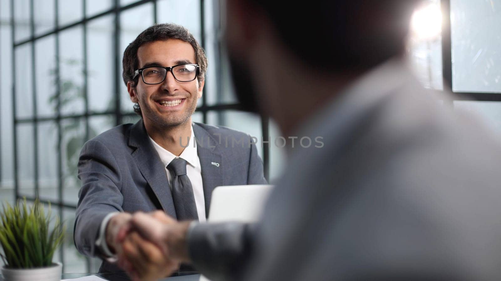 handshake of business People deal business. Hold hand and shaking hand in office