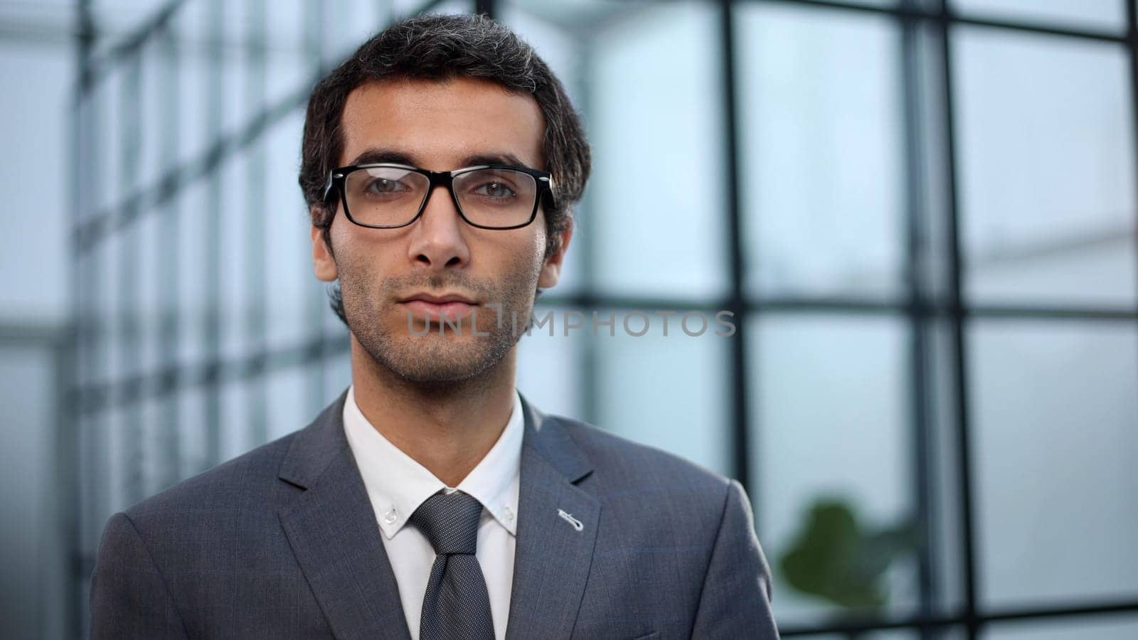 Successful businessman looking at camera with confidence