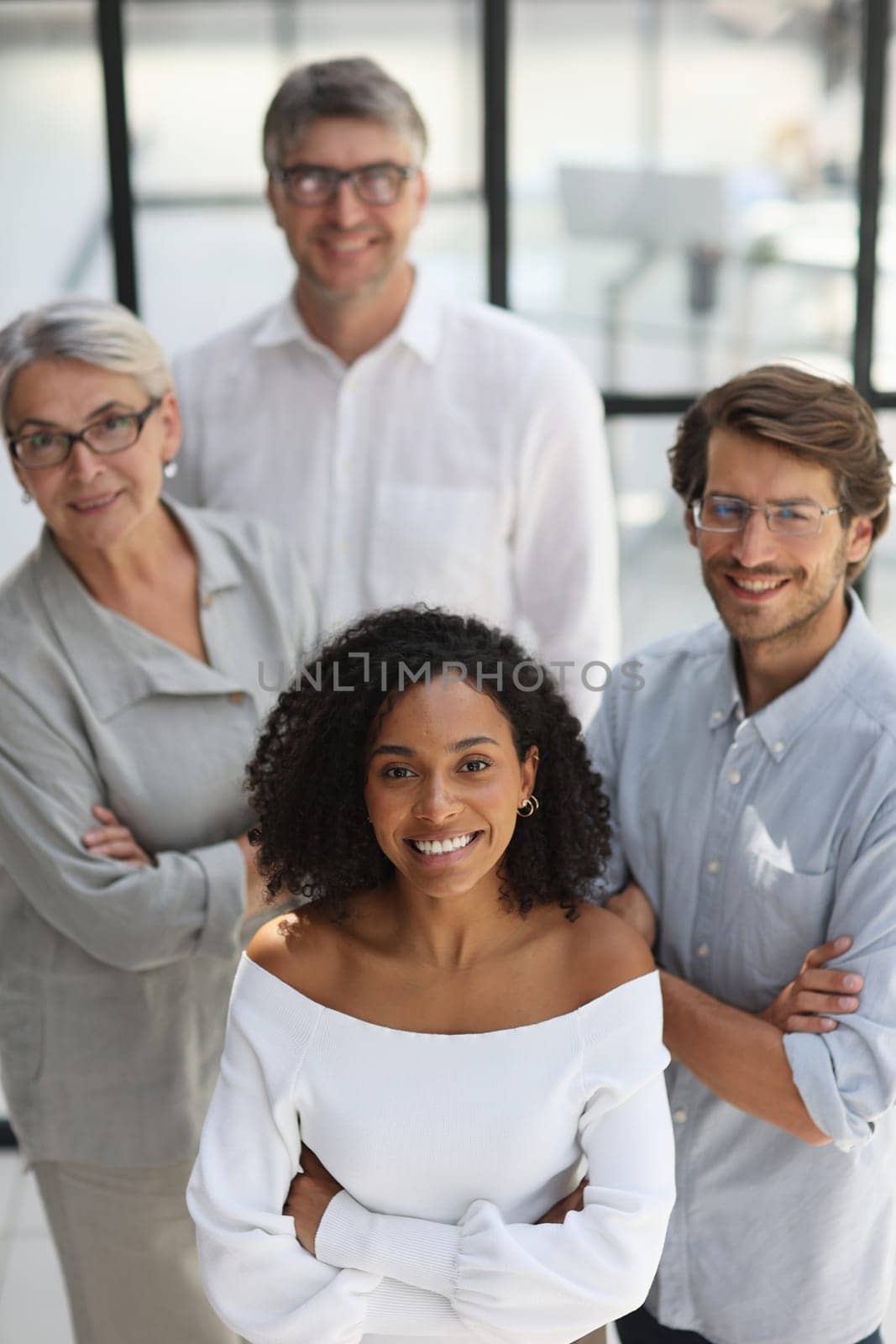 Negotiations in the office. Smiling businesswoman talks with colleagues.