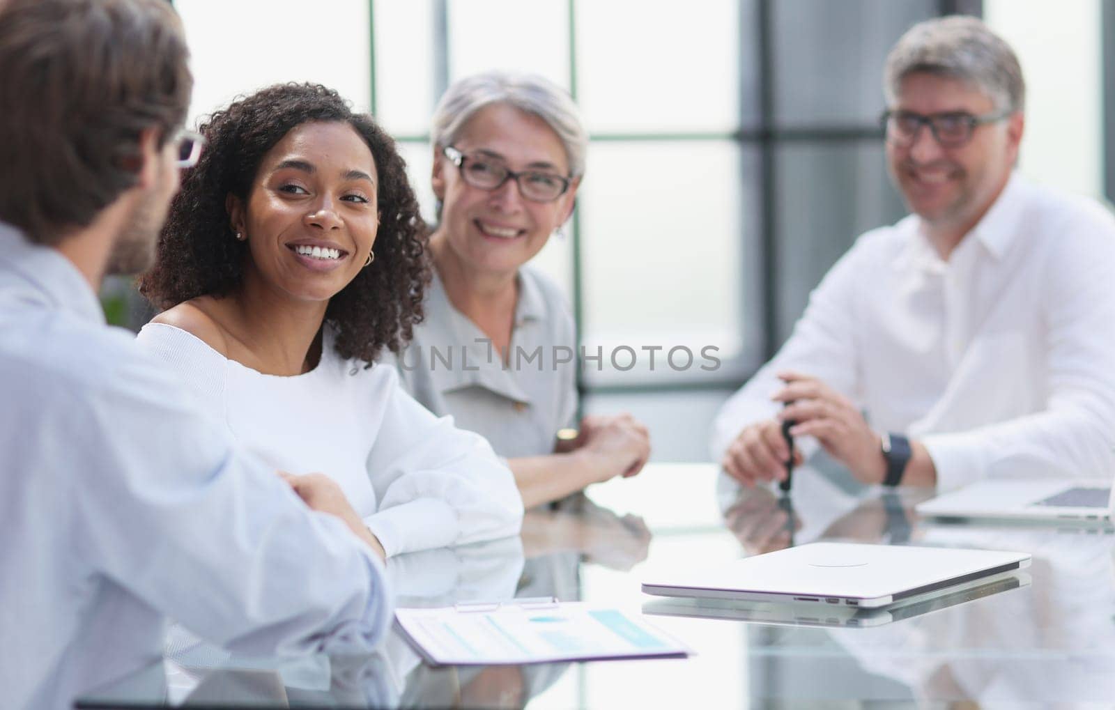 discussion of business people in the office sitting at the table