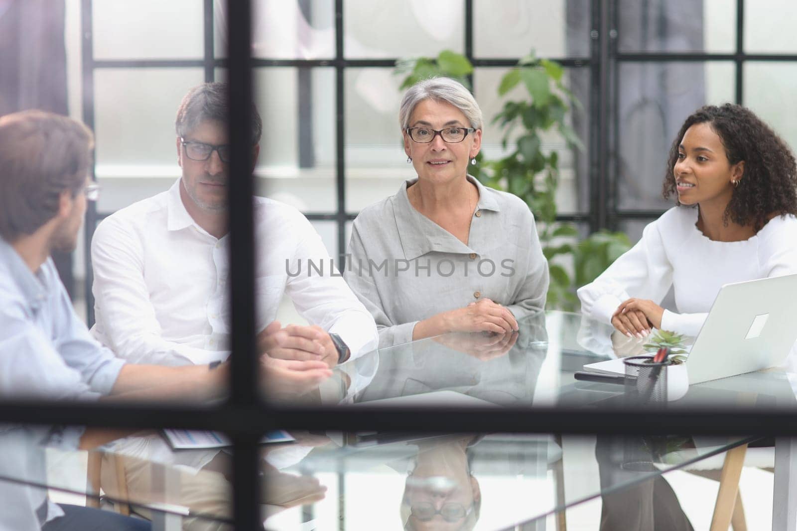 discussion of business people in the office sitting at the table