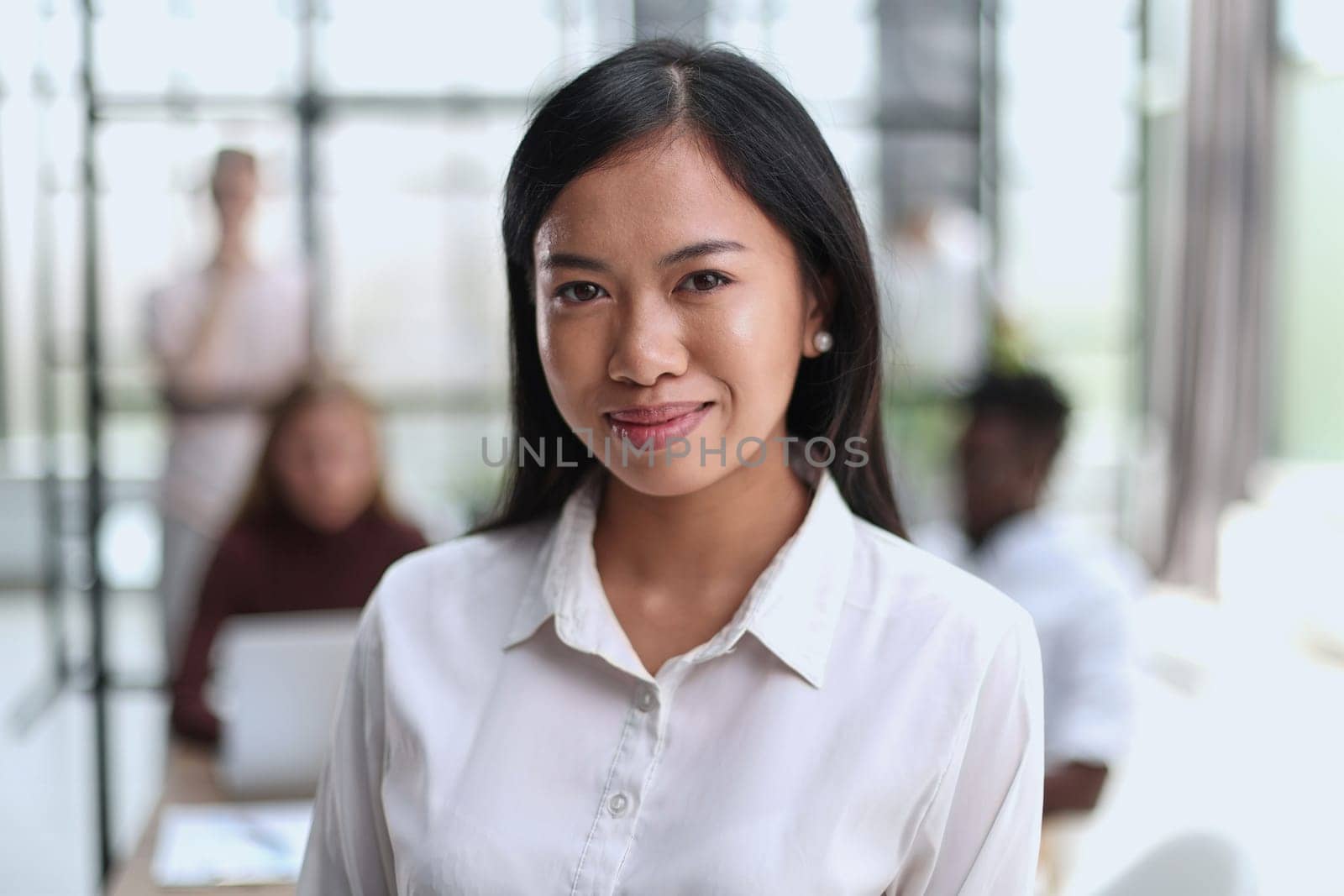 Young beautiful Asian business woman consultant working in the office,