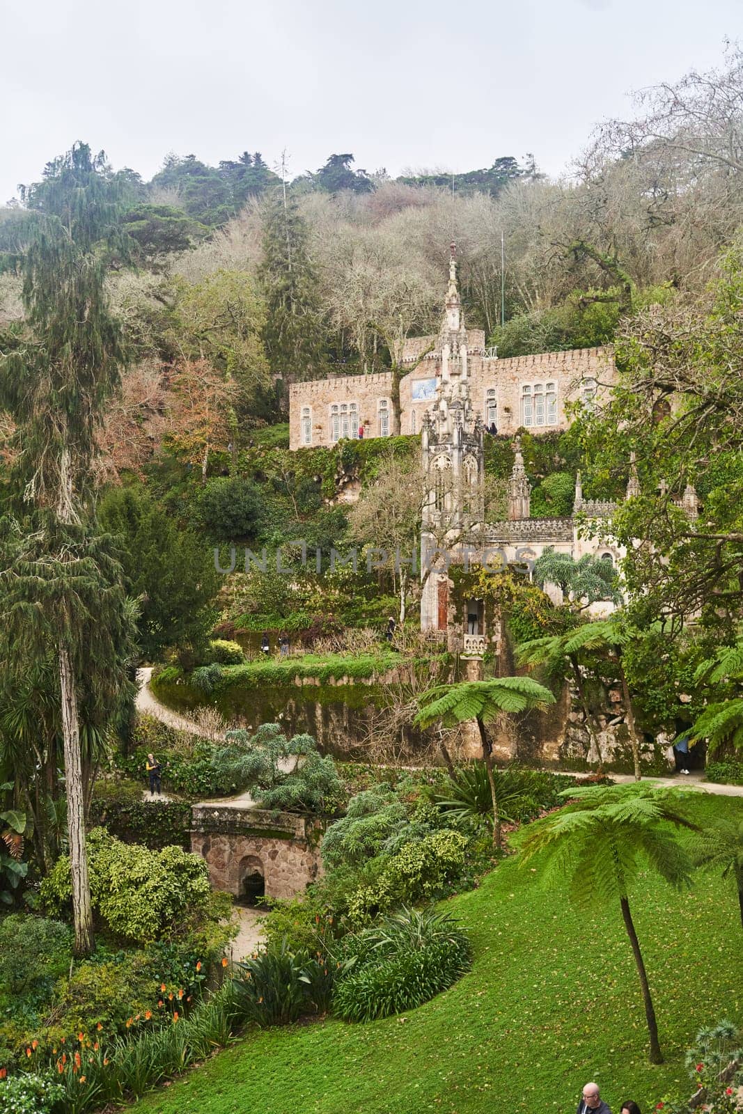 Sintra, Portugal - 28.12.2022: View of the ancient buildings in the Palace and Park Complex of Quinta da Regaleira, Sintra.