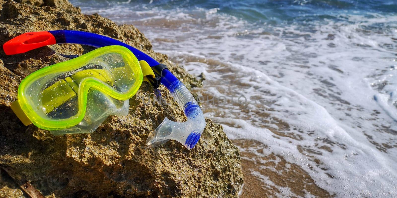 Scuba Diving Equipment. The swimming mask on the sandy beach. snorkeling equipment for driving. High quality photo