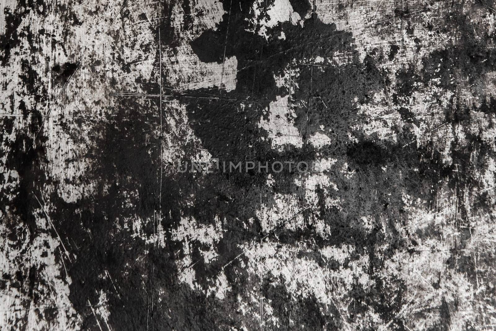 Black and white old grunge scratched metal surface steel background damaged outdated texture obsolete shabby.