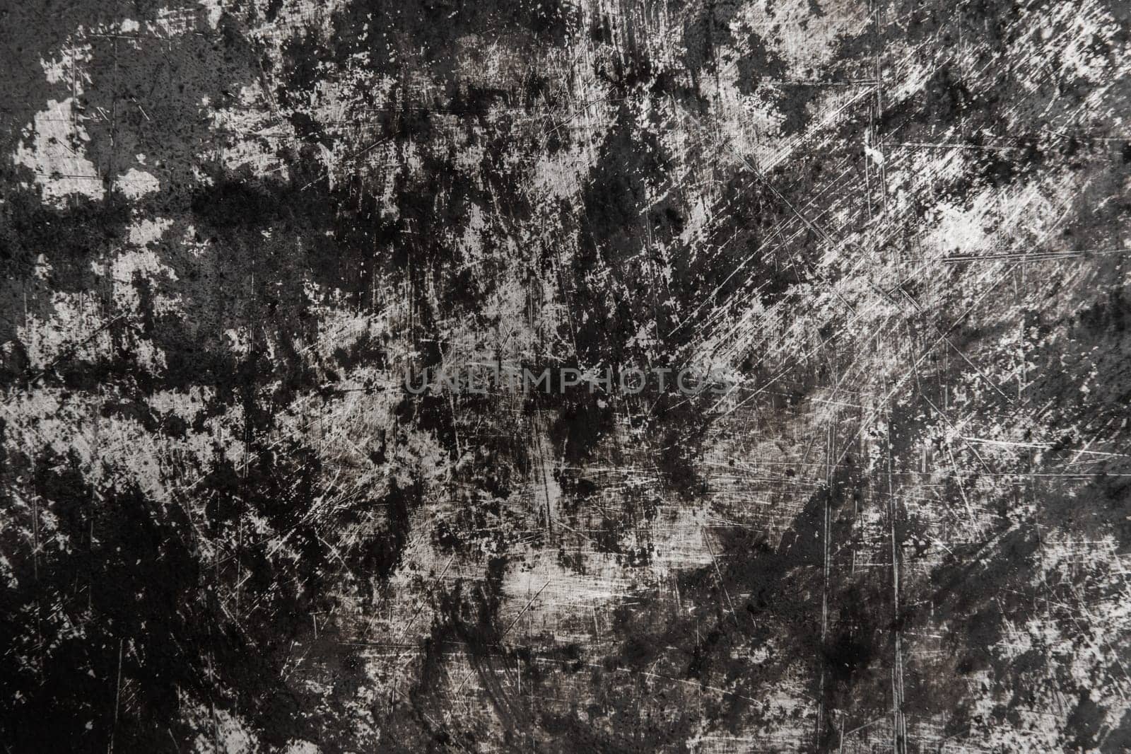 Black and white old grunge scratched metal surface steel background damaged outdated texture obsolete shabby.