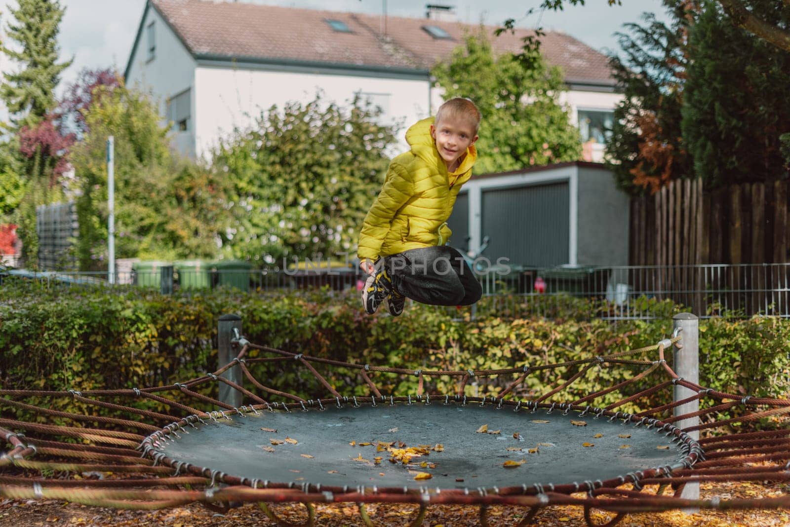 Funny cute happy baby playing on the playground. The emotion of happiness, fun, joy. Smile of a child. boy playing on the playground.