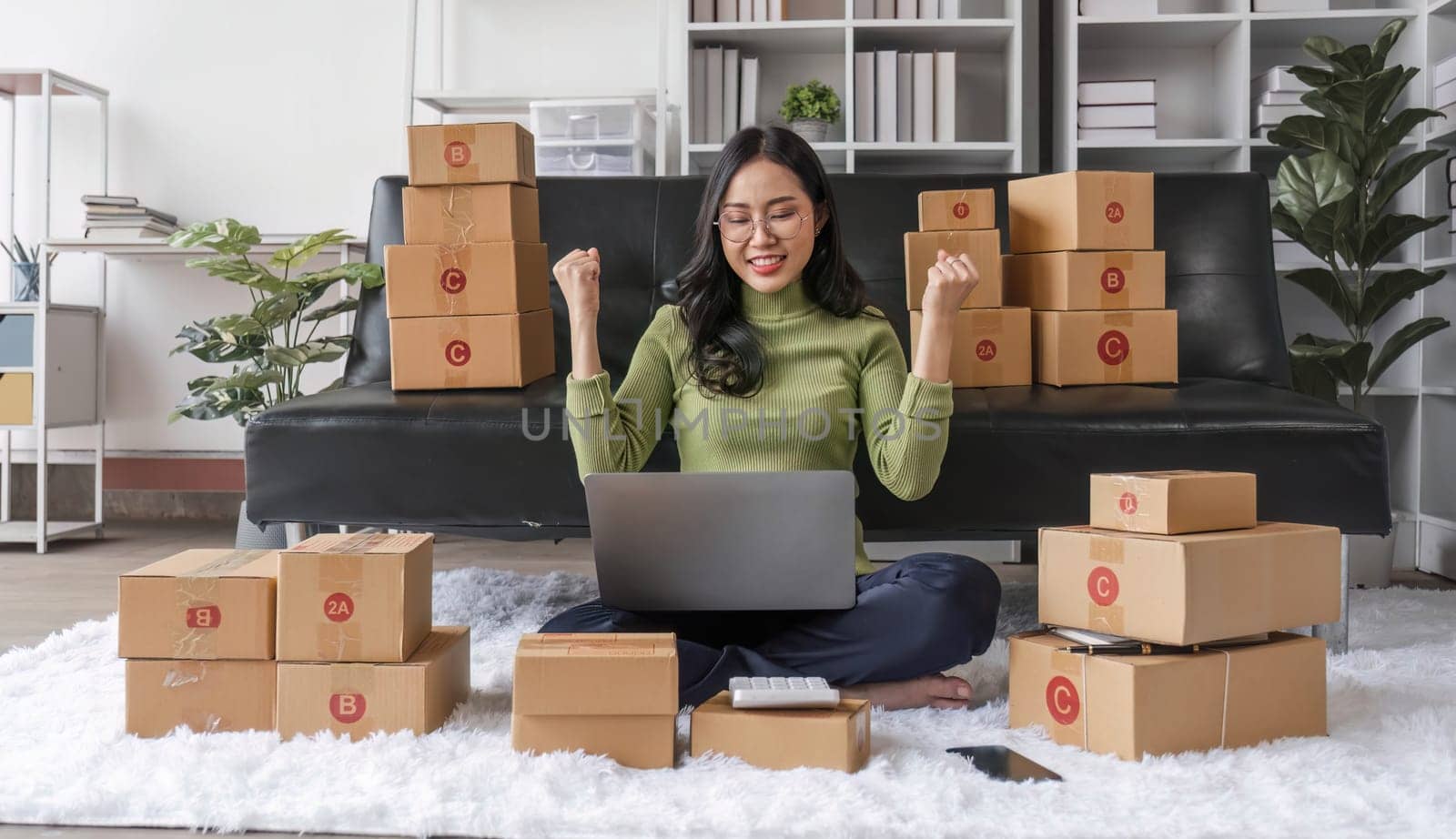 Startup small business entrepreneur SME, asian woman packing cloth in box. Portrait young Asian small business owner home office, online sell marketing delivery, SME e-commerce telemarketing concept