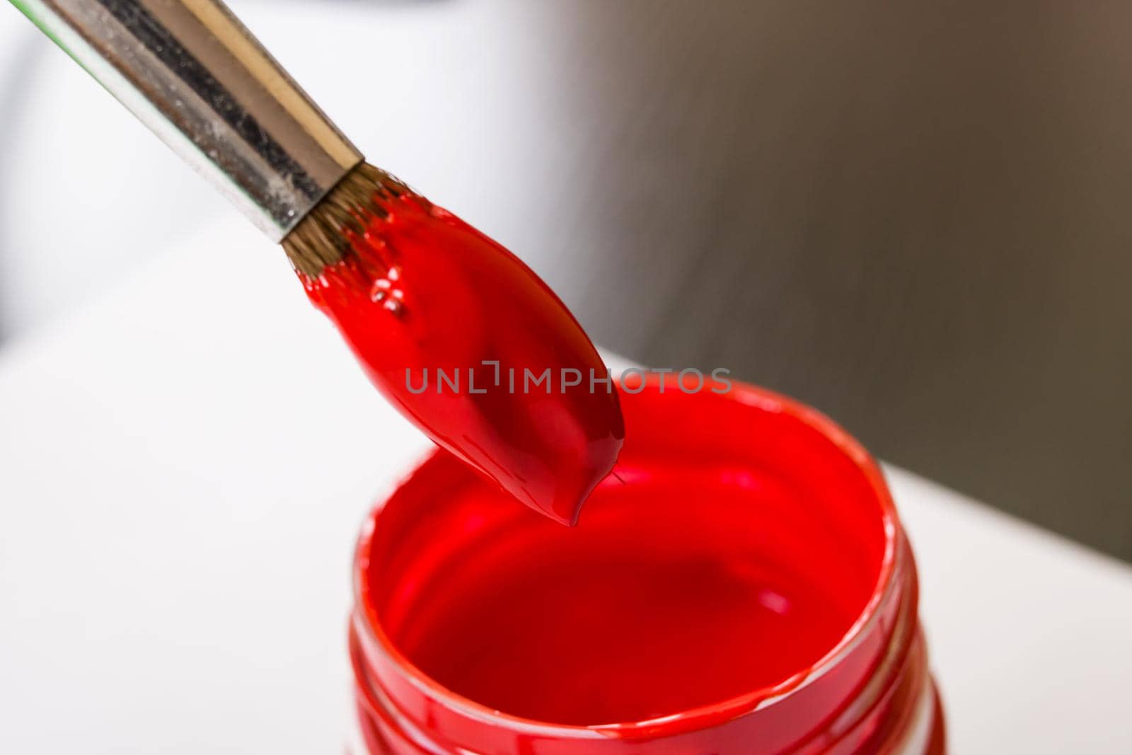 Brush for red paint and can close up
