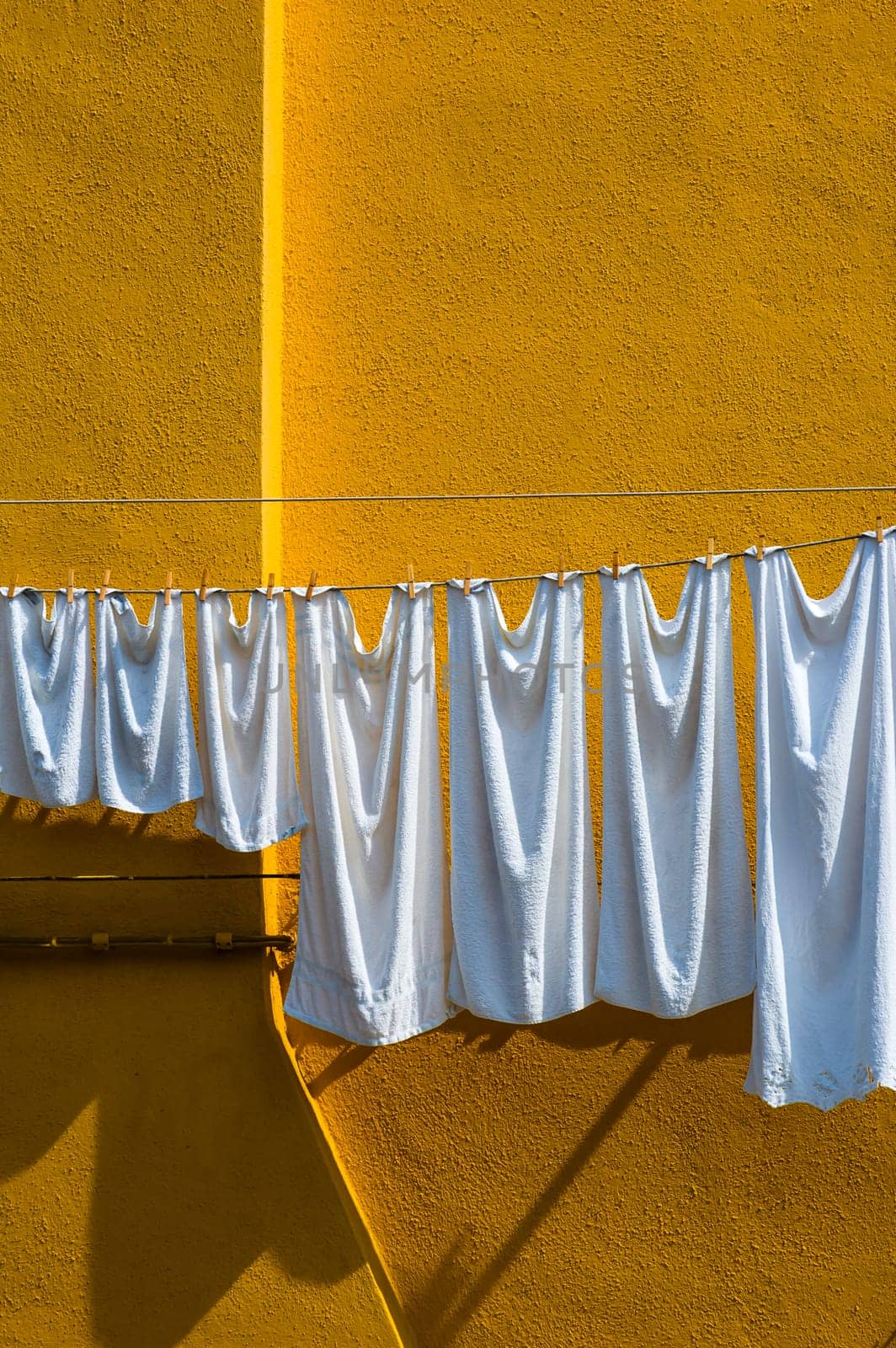 The island of Burano in the Venetian lagoon famous for its brightly colored houses